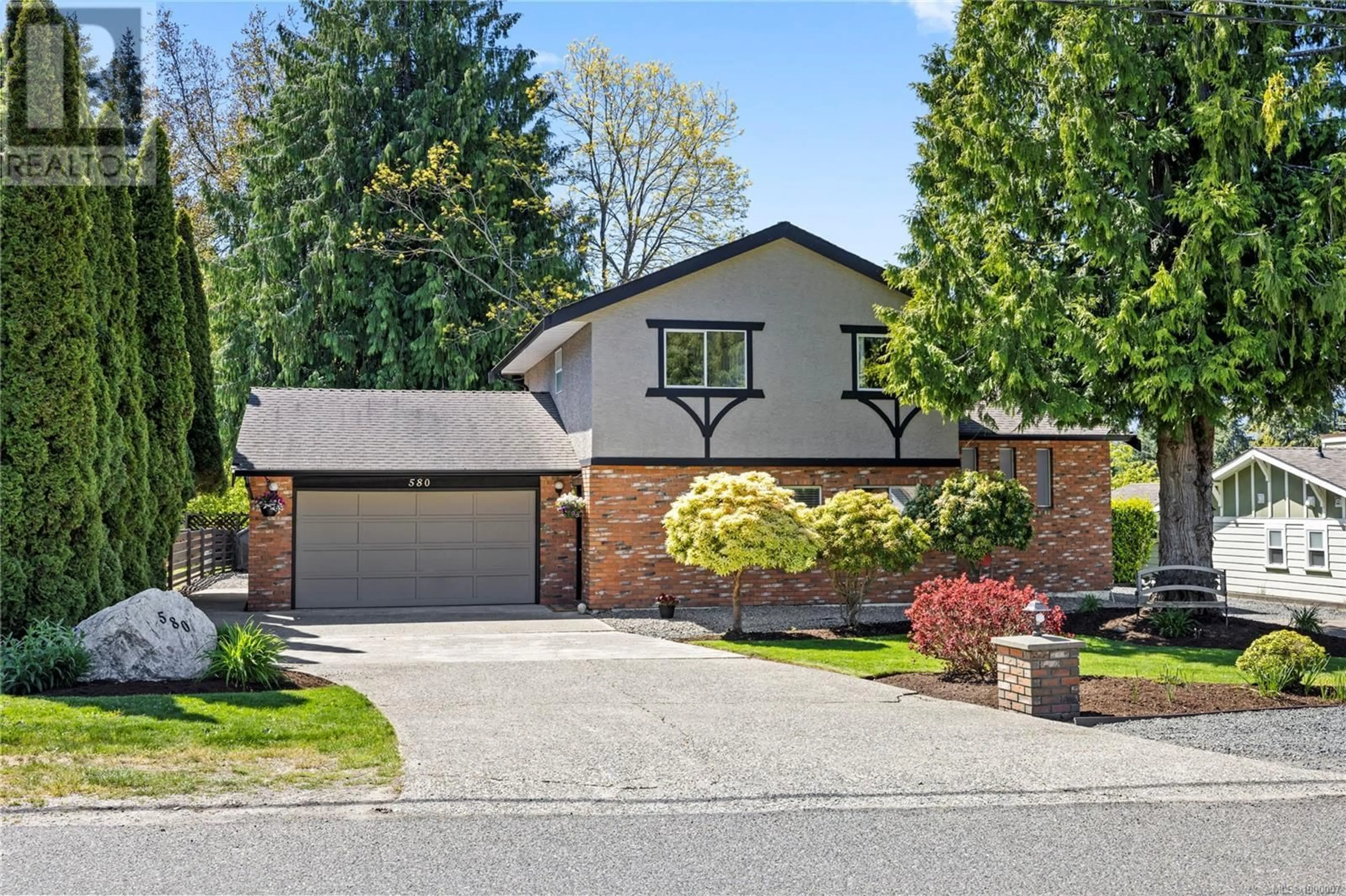 Home with brick exterior material, street for 580 TAMARACK DRIVE, Qualicum Beach British Columbia V9K1A7