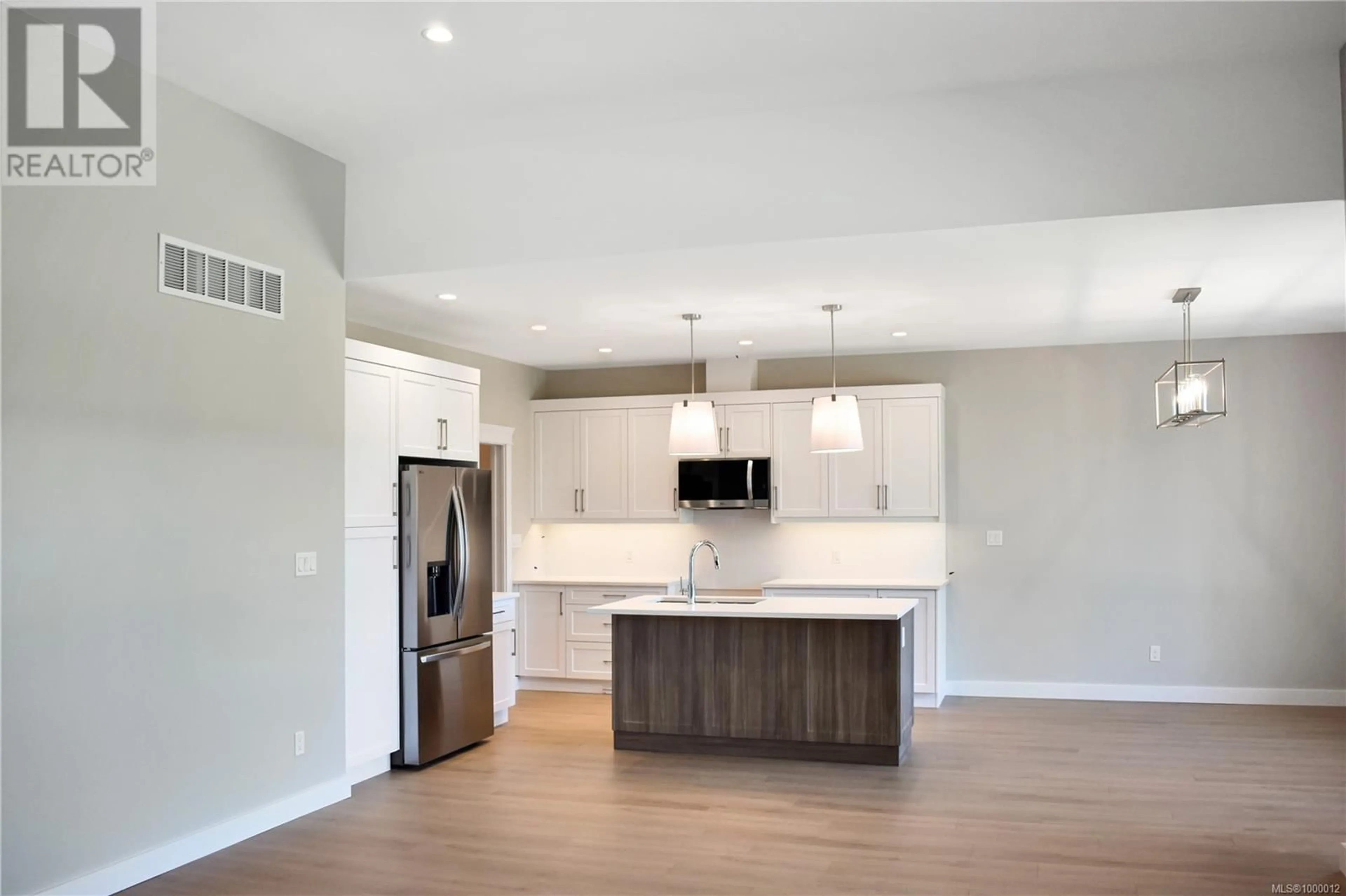 Open concept kitchen, wood/laminate floor for 275 WALWORTH ROAD SOUTH, Campbell River British Columbia V9W0A8