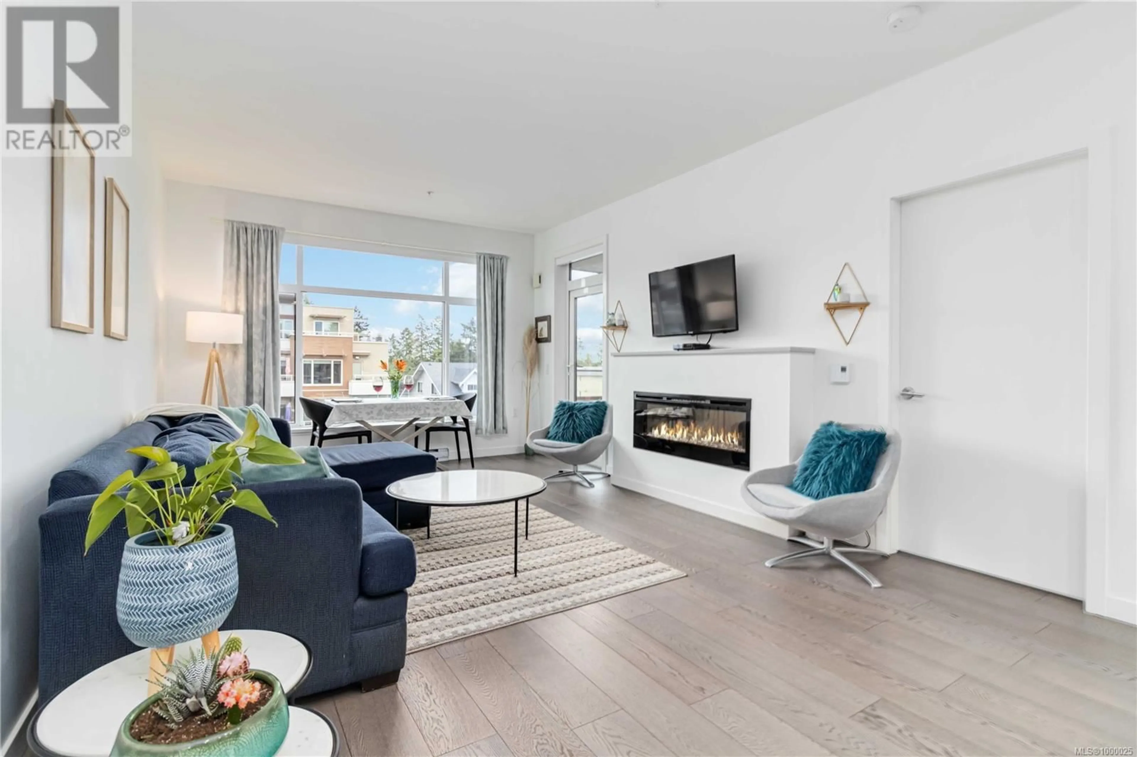 Living room with furniture, unknown for 403 - 7162 WEST SAANICH ROAD, Central Saanich British Columbia V8M1P6