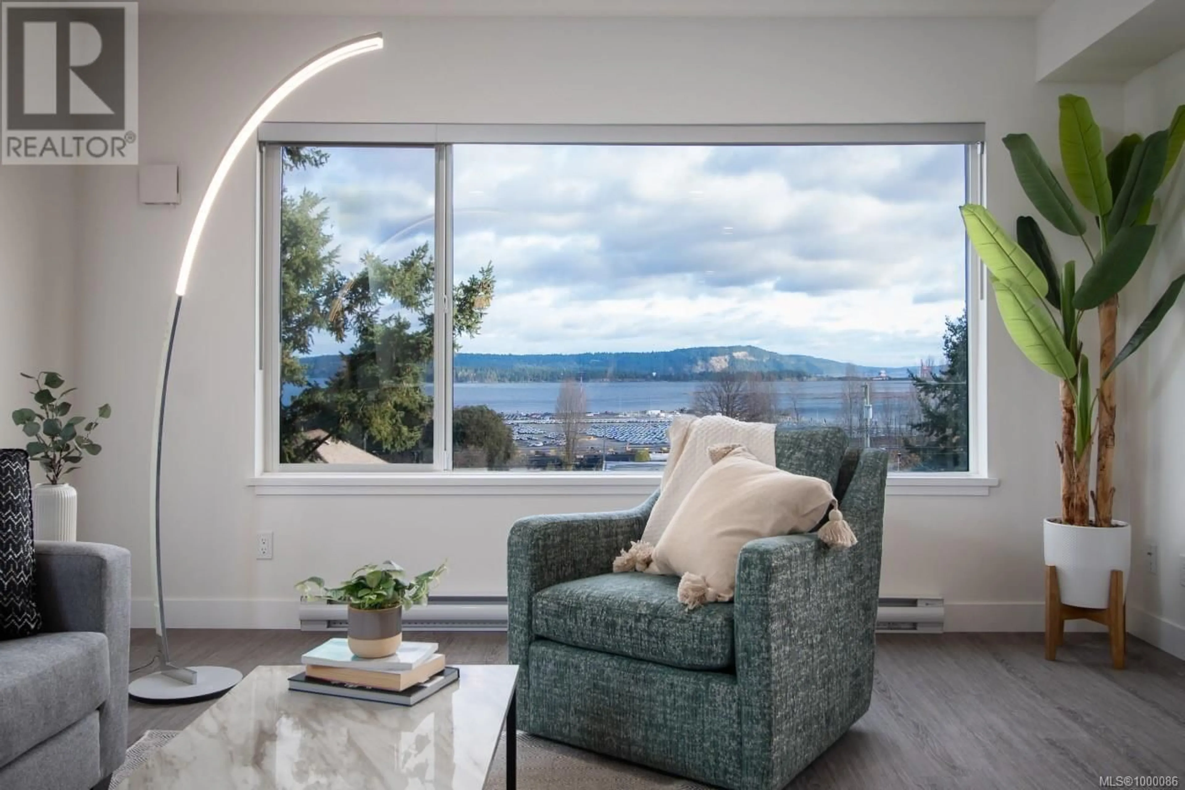 Living room with furniture, wood/laminate floor for 207 - 135 HALIBURTON STREET, Nanaimo British Columbia V9R4V9