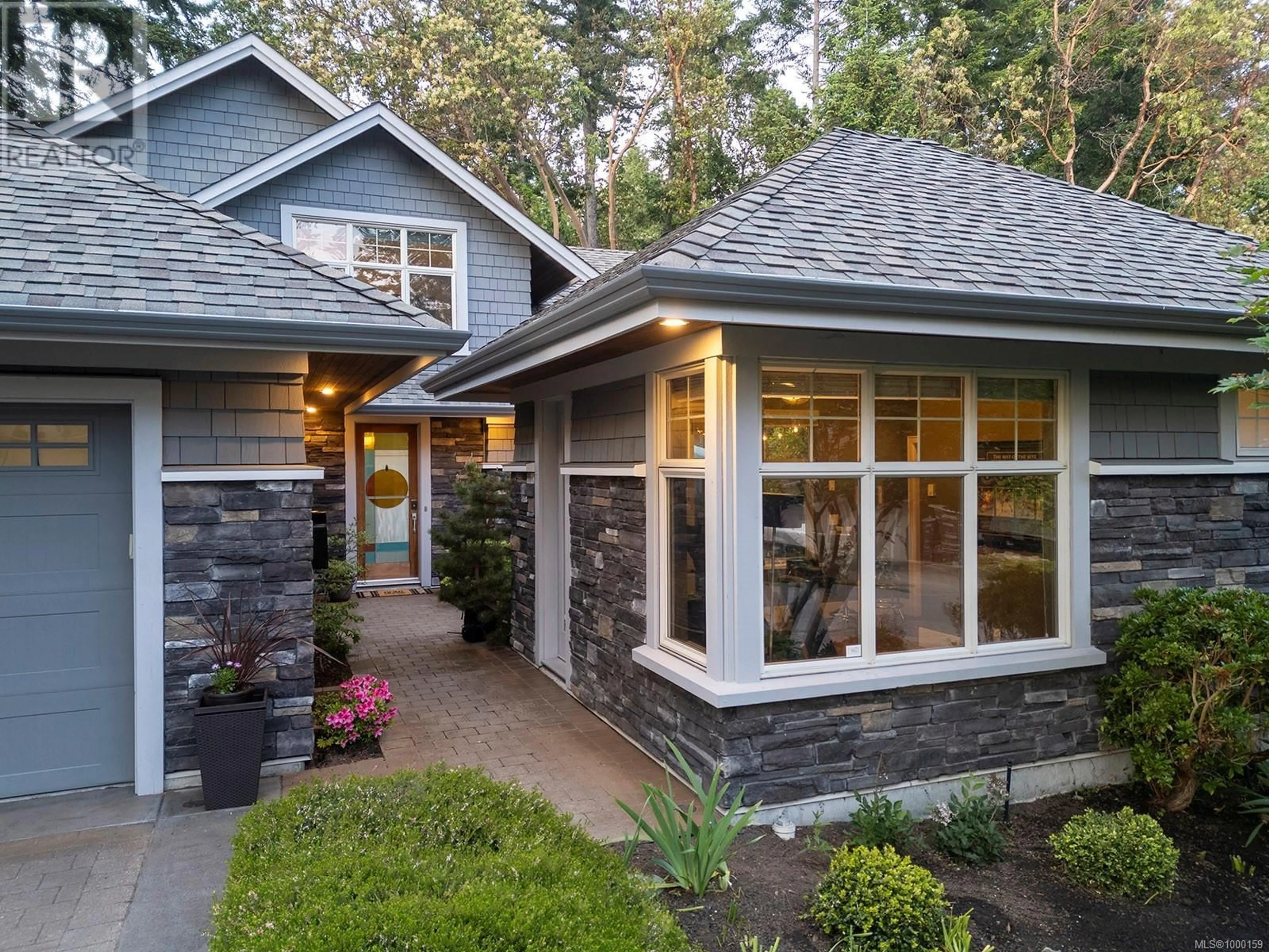Home with brick exterior material, street for 1267 OCEANWOOD LANE, Saanich British Columbia V8X0A4