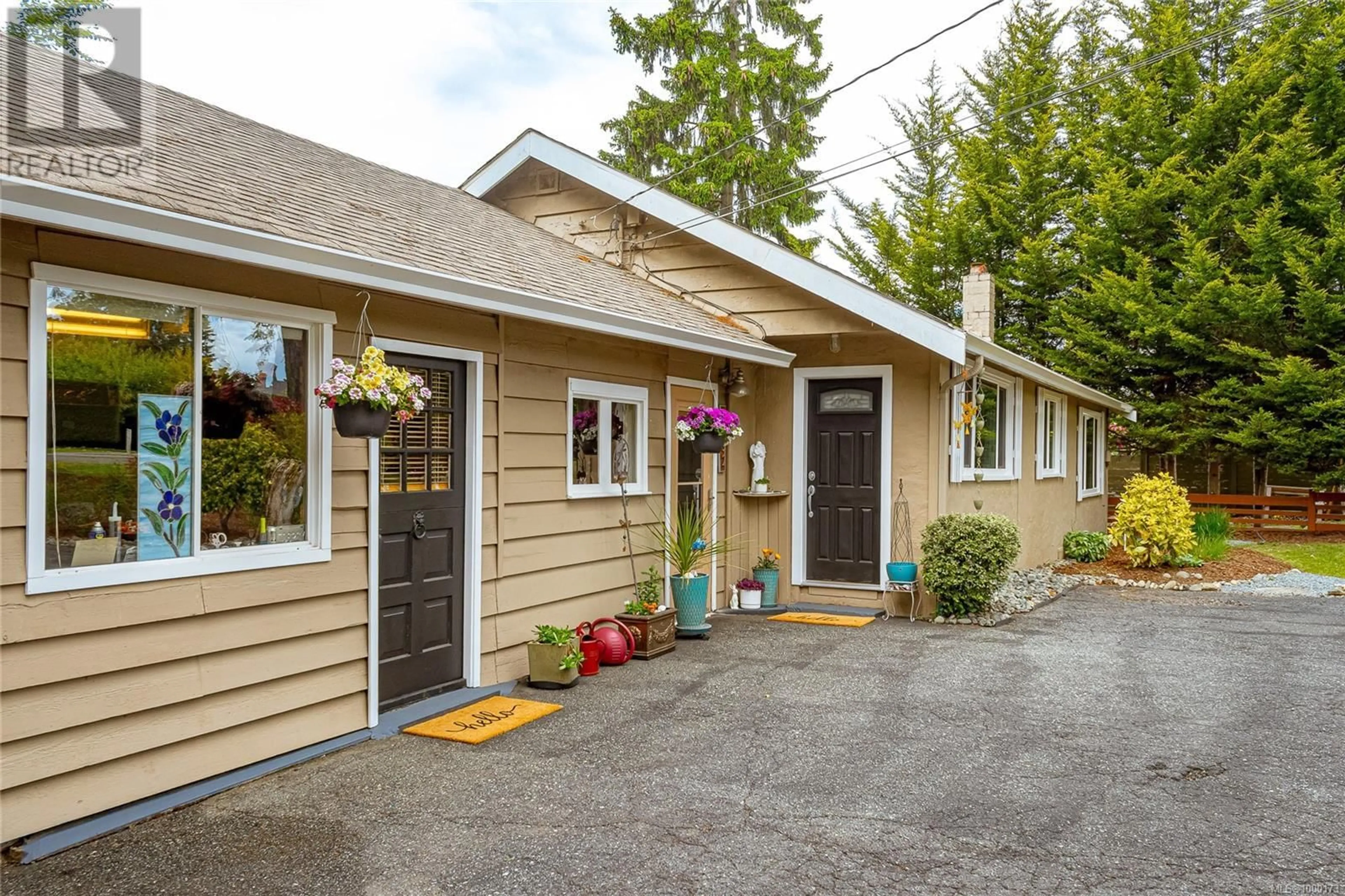 Home with vinyl exterior material, street for 7032 WEST SAANICH ROAD, Central Saanich British Columbia V8M1G8