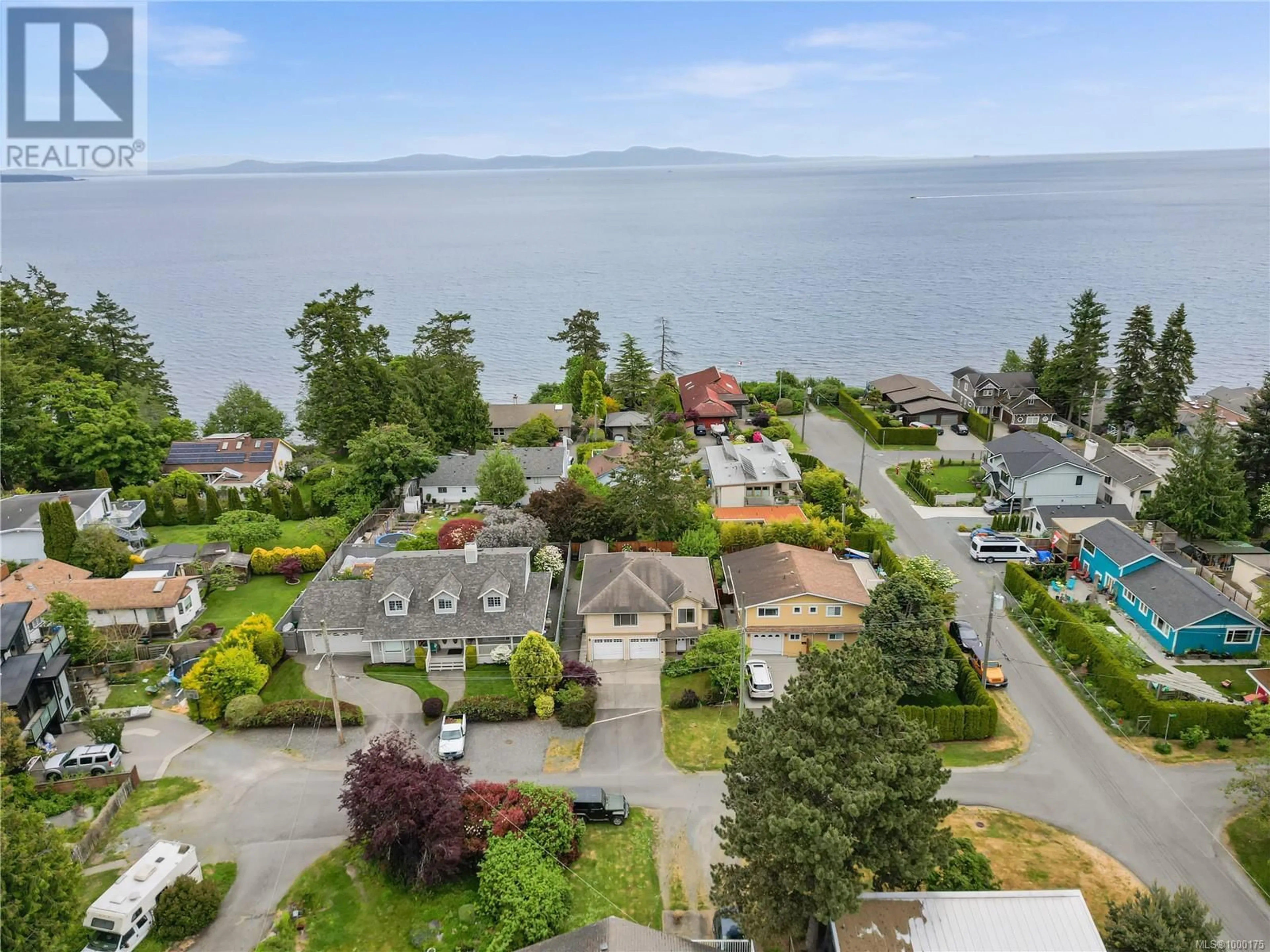 A pic from outside/outdoor area/front of a property/back of a property/a pic from drone, water/lake/river/ocean view for 5211 SARK ROAD, Saanich British Columbia V8Y2M4