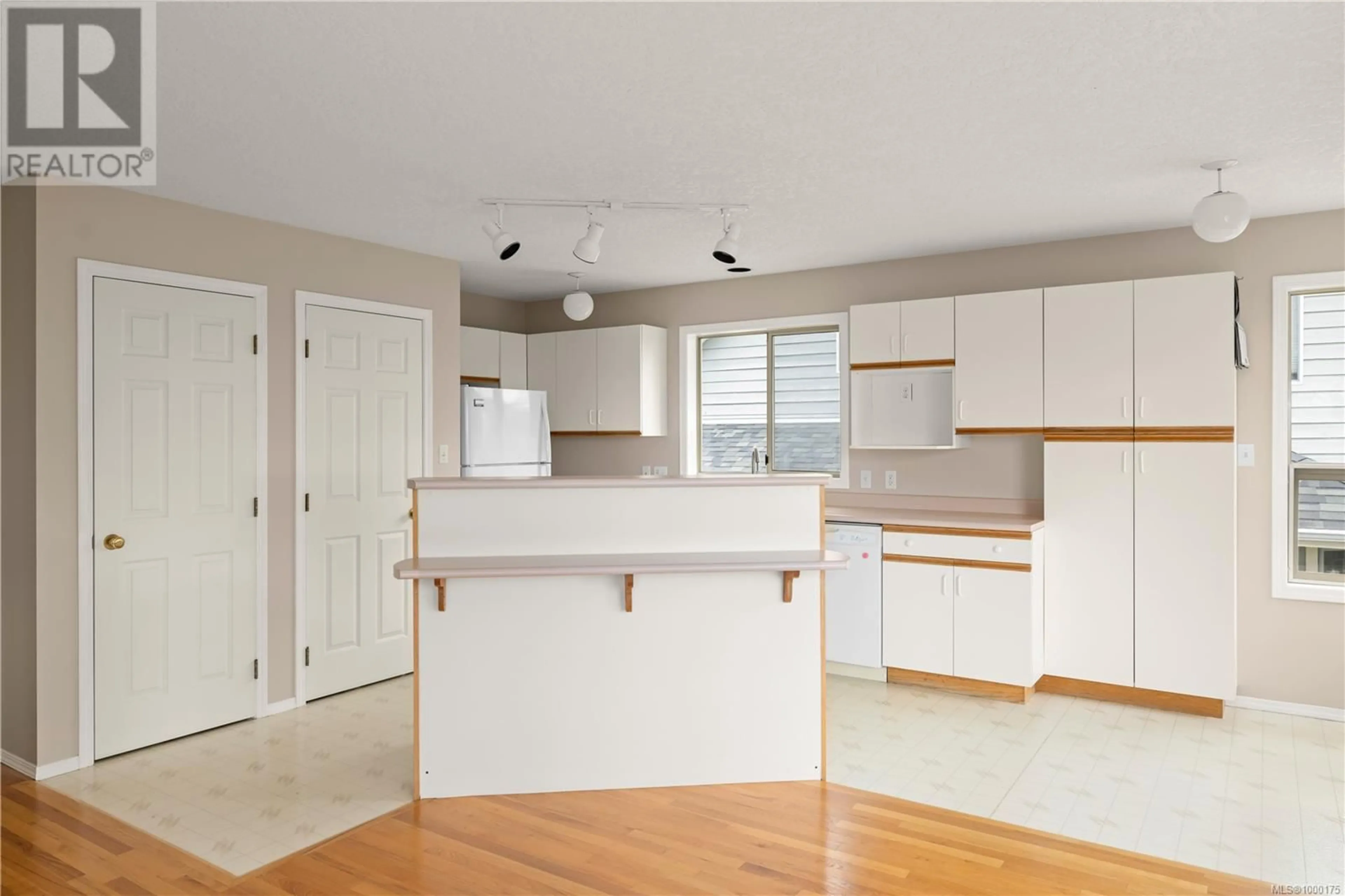 Open concept kitchen, wood/laminate floor for 5211 SARK ROAD, Saanich British Columbia V8Y2M4