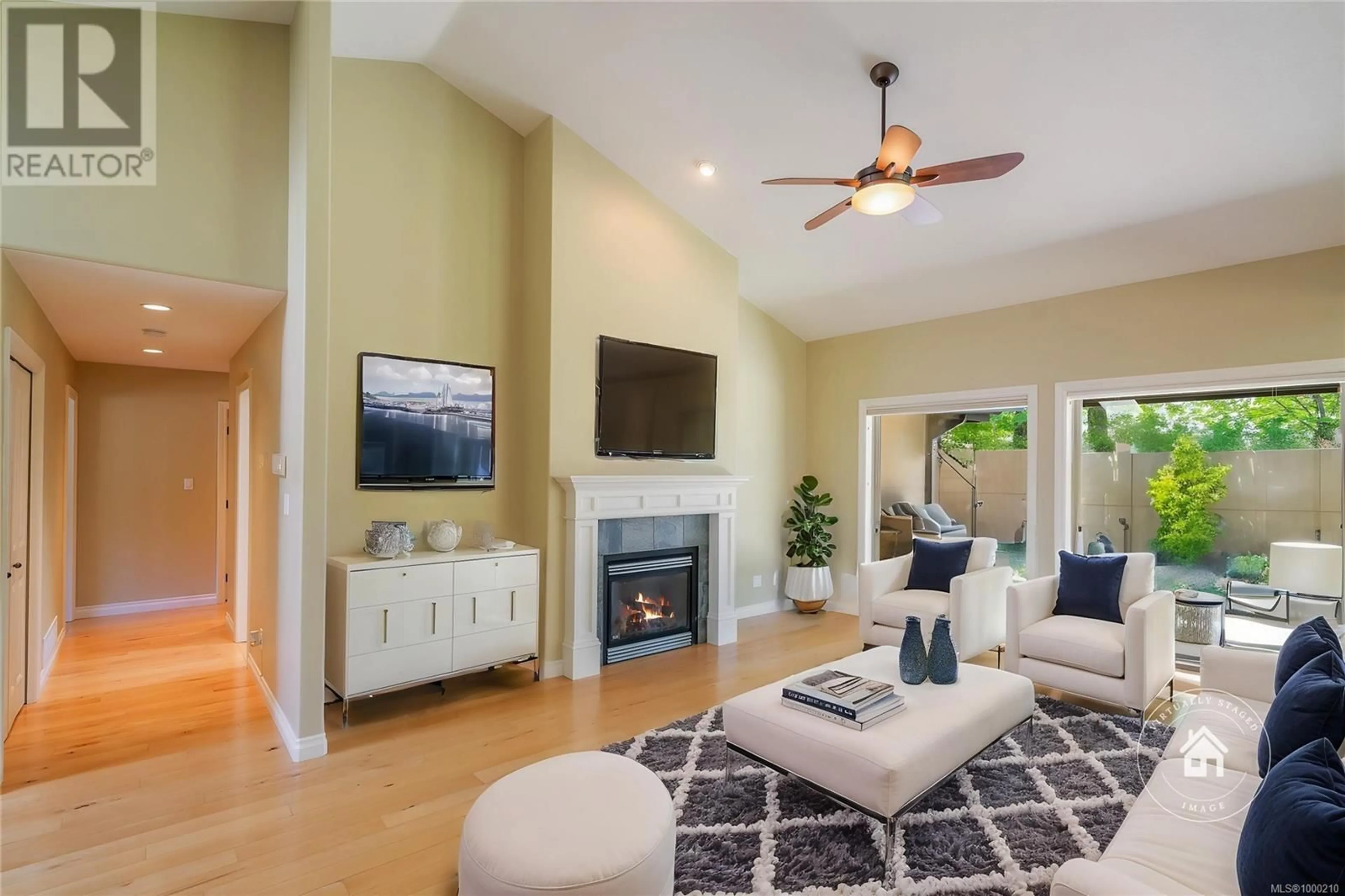 Living room with furniture, unknown for 978 CANTEBURY PLACE, Qualicum Beach British Columbia V9K0A1