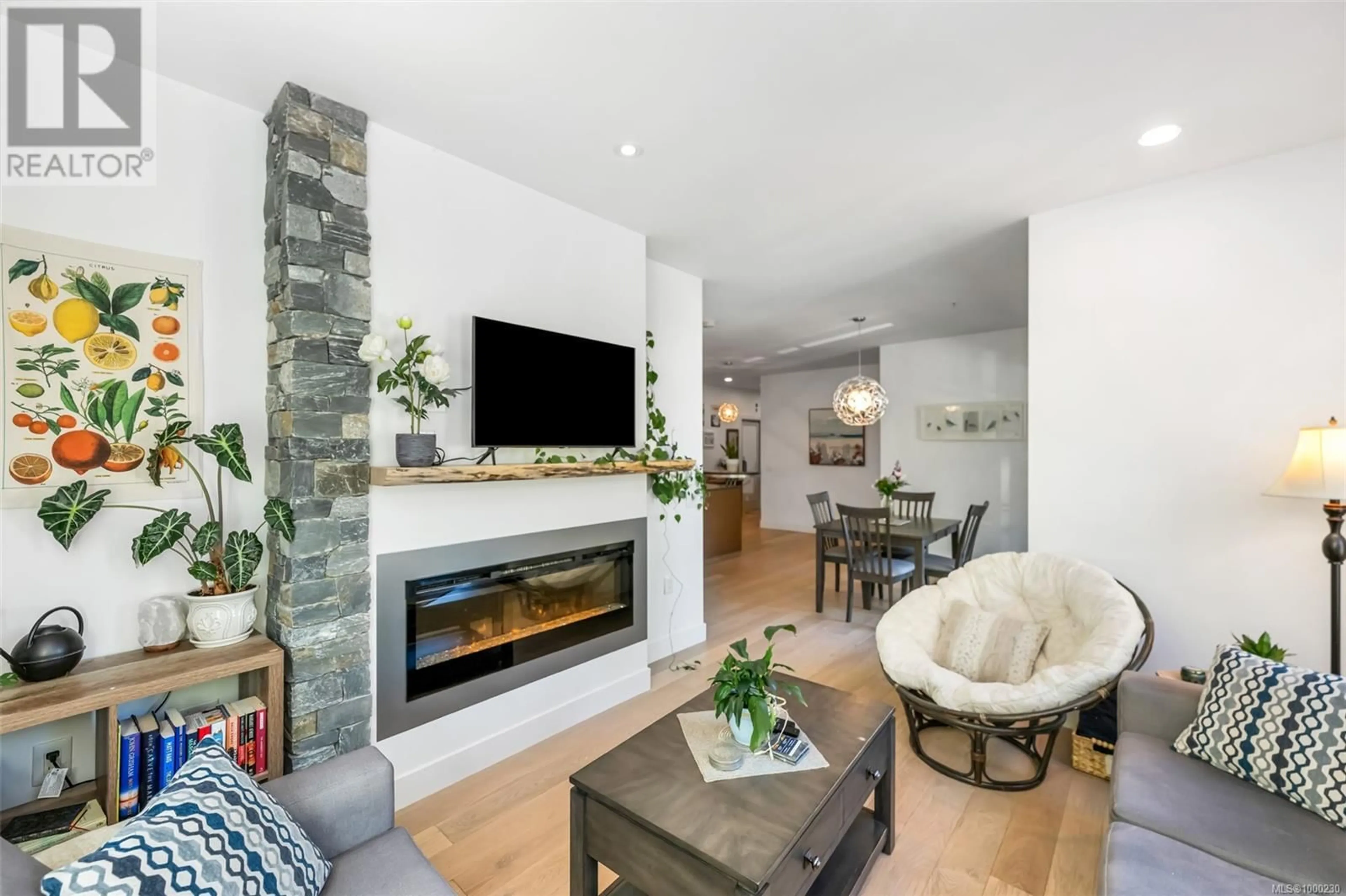 Living room with furniture, unknown for 201 - 2580 PENRHYN STREET, Saanich British Columbia V8N1G3