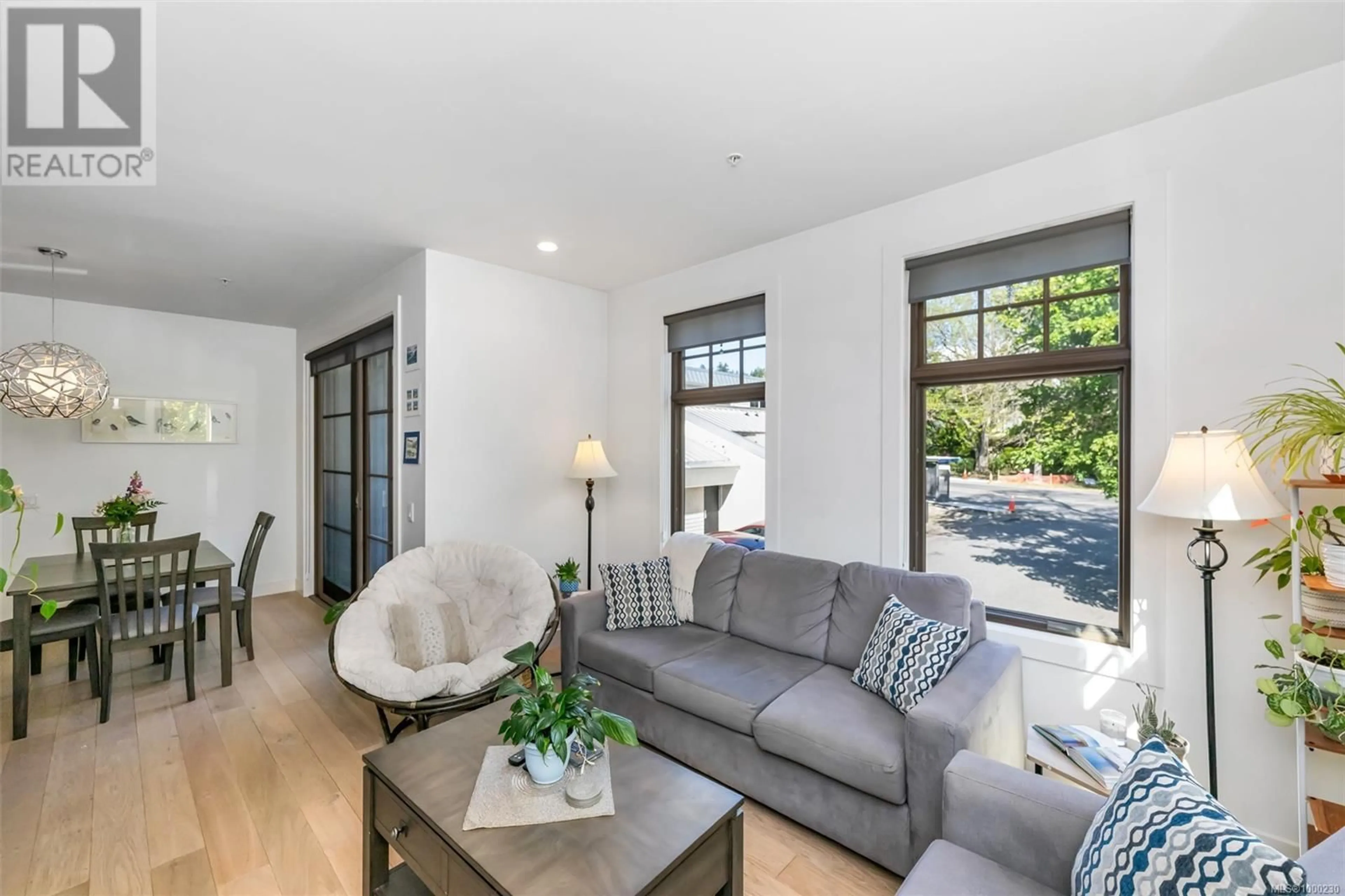 Living room with furniture, unknown for 201 - 2580 PENRHYN STREET, Saanich British Columbia V8N1G3
