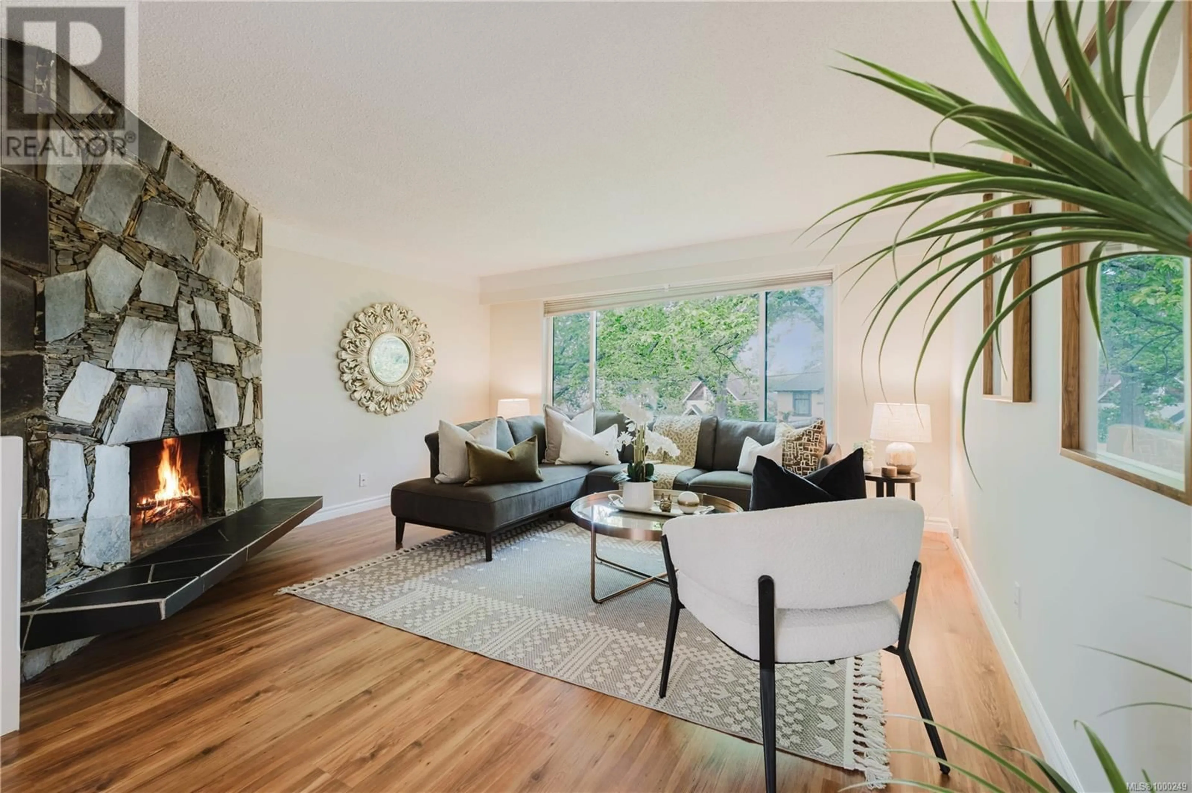 Living room with furniture, wood/laminate floor for 2657 CEDAR HILL ROAD, Victoria British Columbia V8T3H1