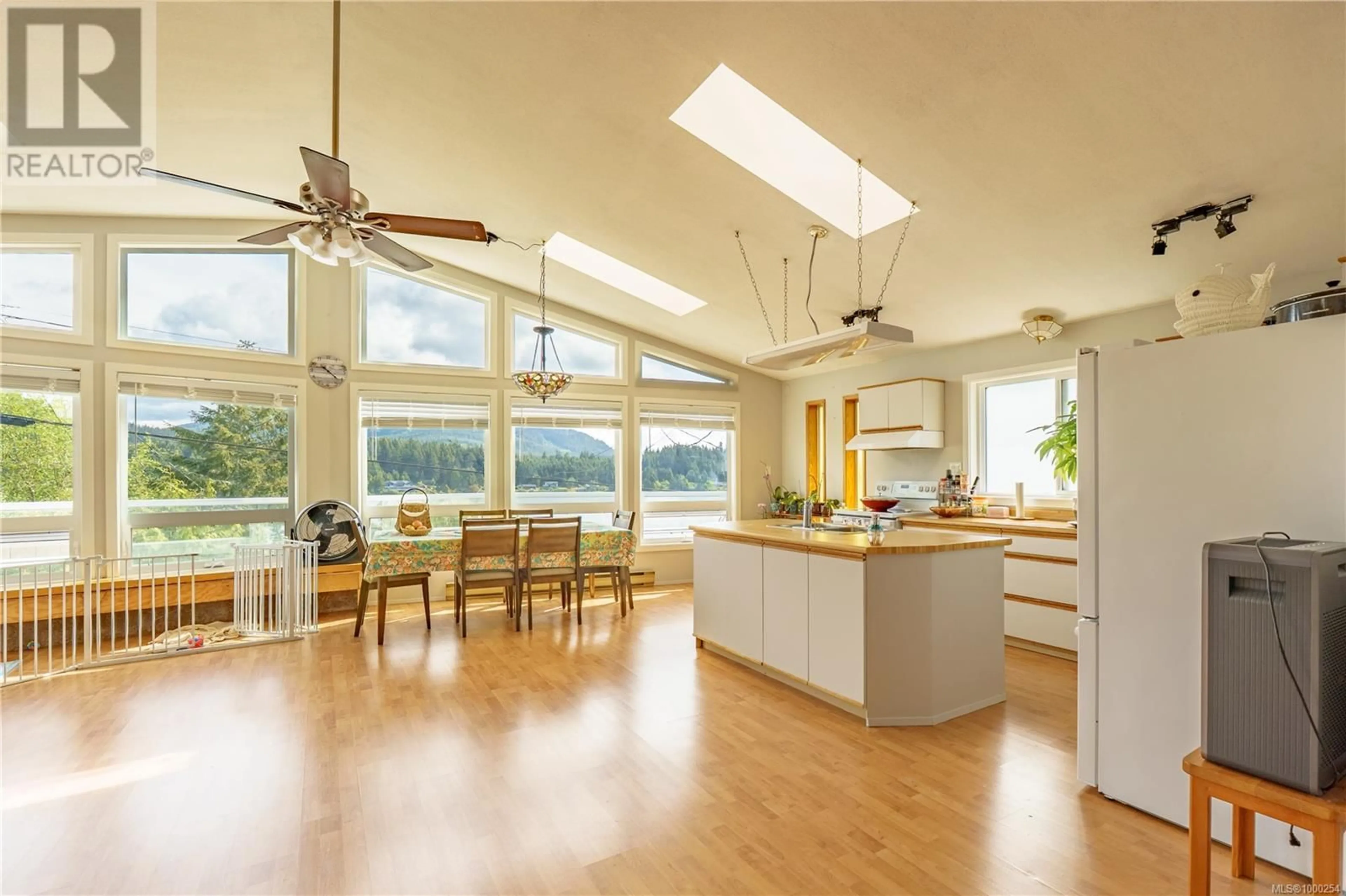Open concept kitchen, wood/laminate floor for 1483 HELEN ROAD, Ucluelet British Columbia V0R3A0