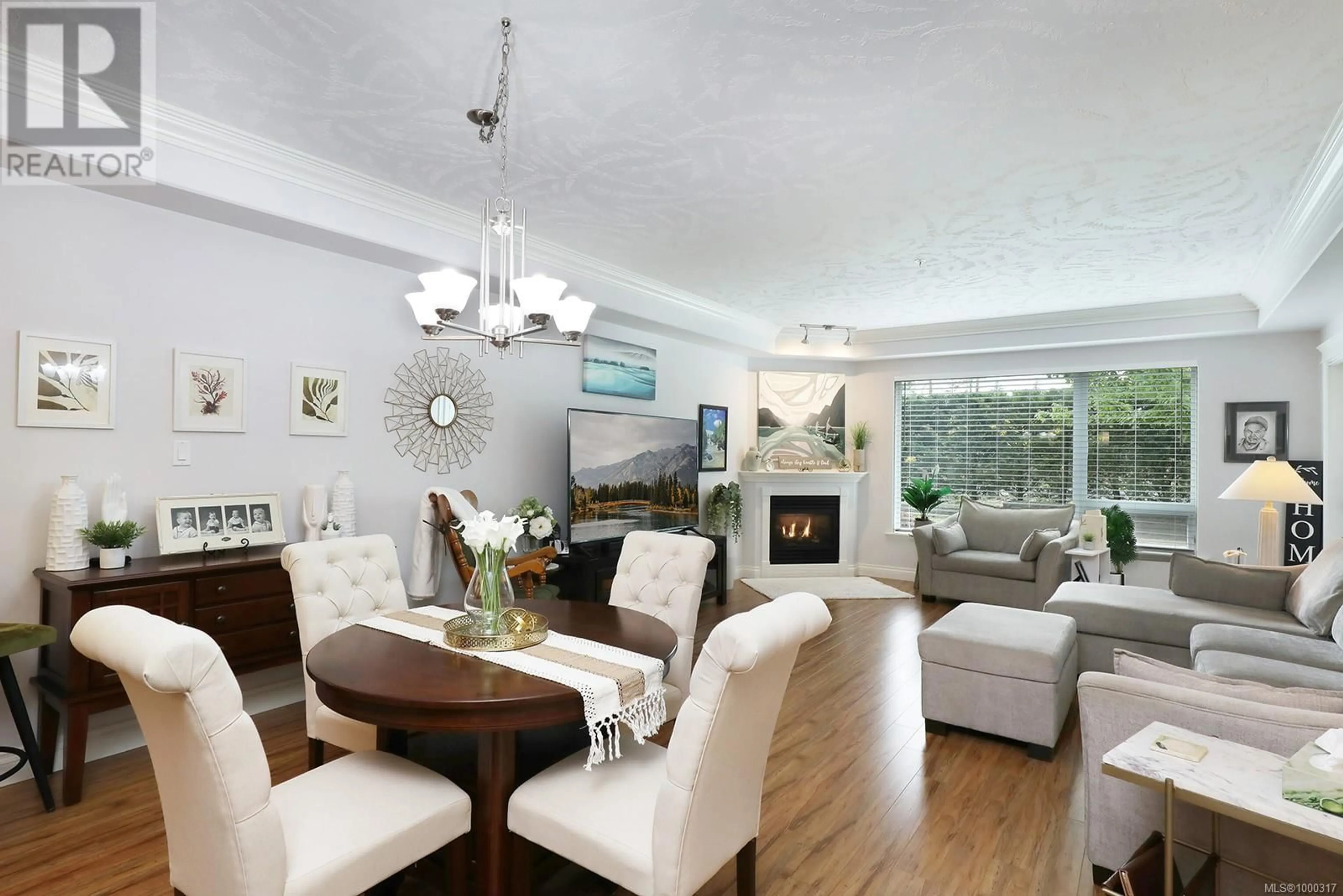 Living room with furniture, wood/laminate floor for 613 - 3666 ROYAL VISTA WAY, Courtenay British Columbia V9N9X8