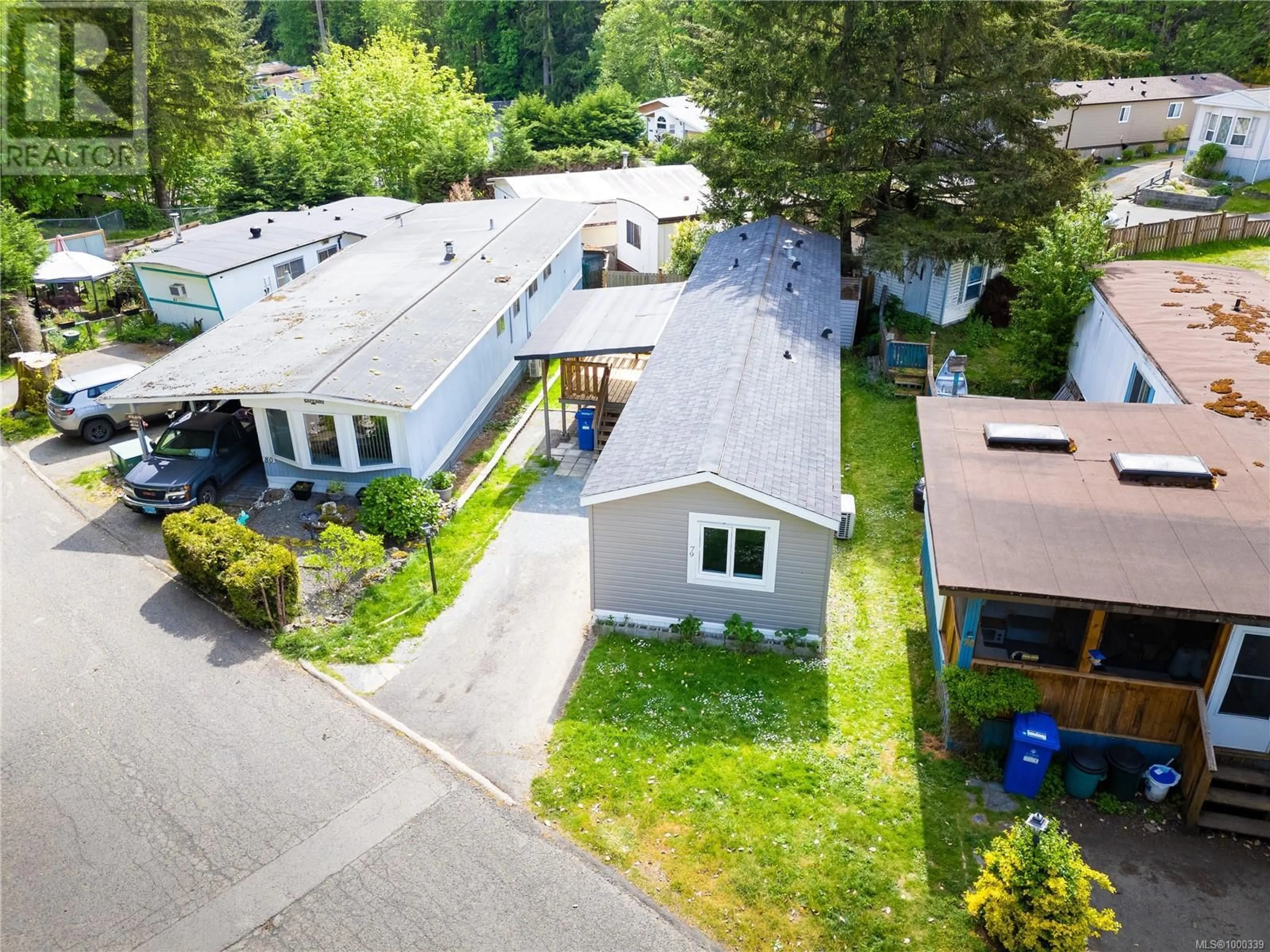 A pic from outside/outdoor area/front of a property/back of a property/a pic from drone, street for 79 - 2785 WALLBANK ROAD, Shawnigan Lake British Columbia V8H2A5