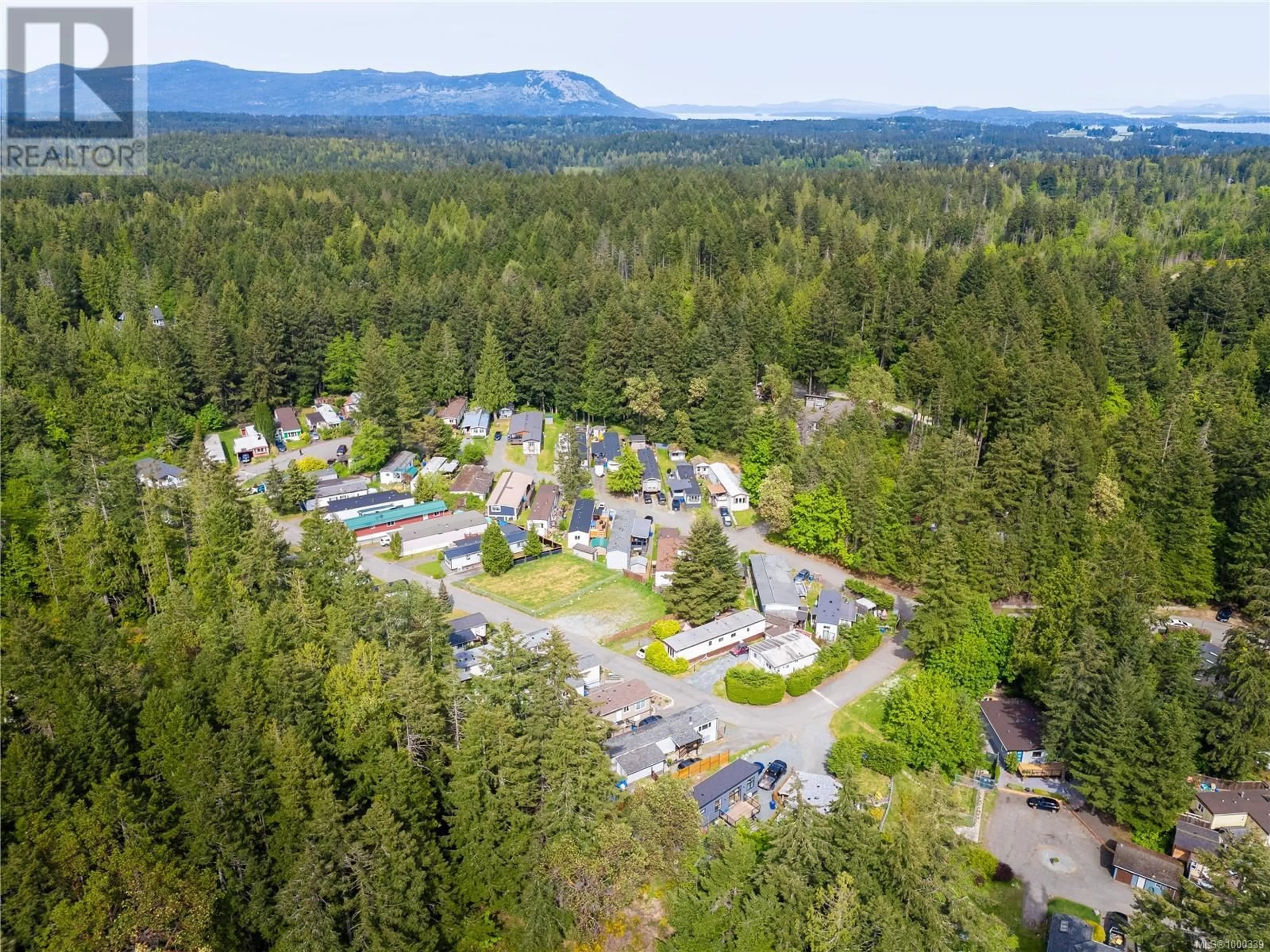 A pic from outside/outdoor area/front of a property/back of a property/a pic from drone, mountain view for 79 - 2785 WALLBANK ROAD, Shawnigan Lake British Columbia V8H2A5