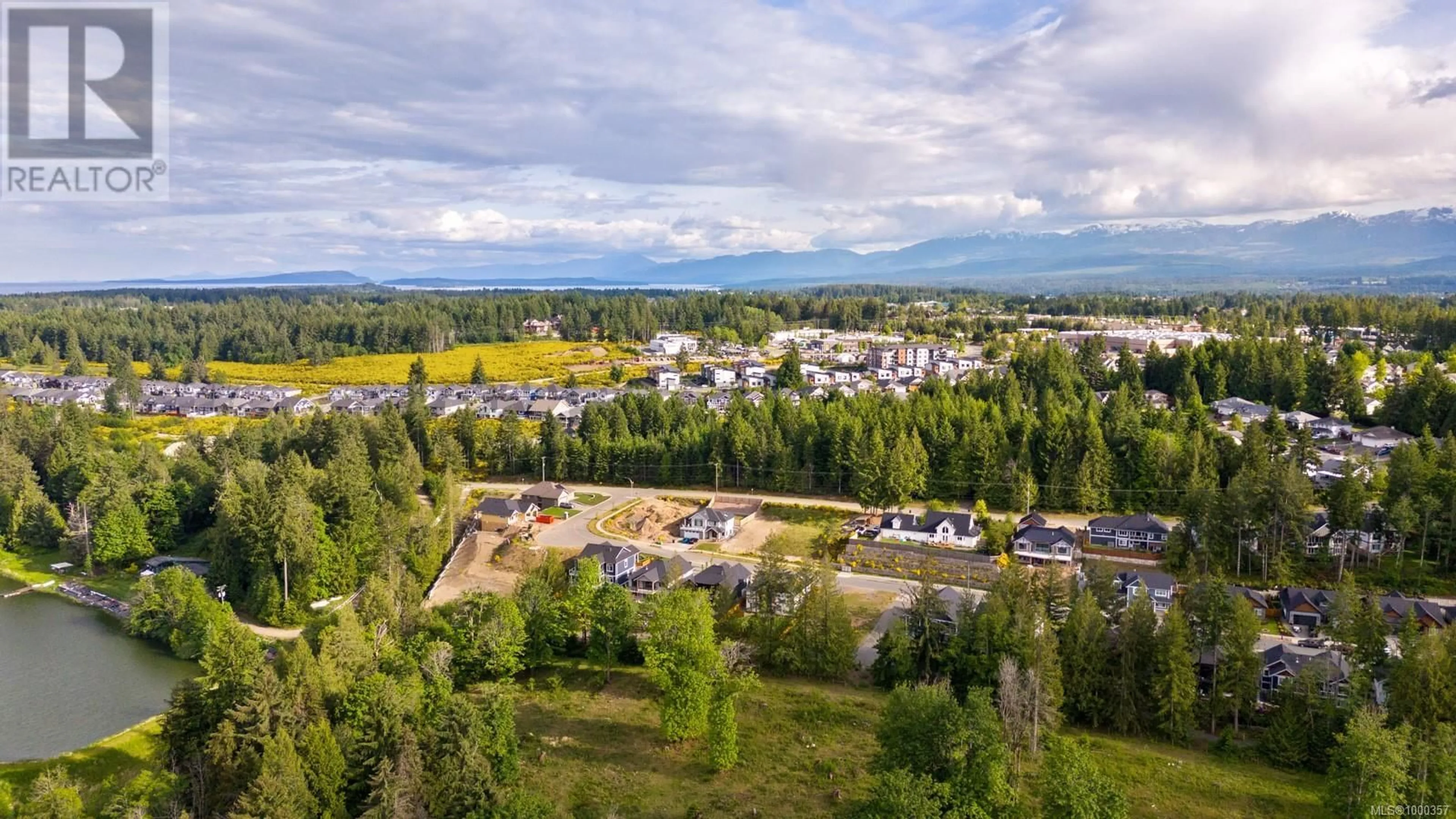 A pic from outside/outdoor area/front of a property/back of a property/a pic from drone, mountain view for 3282 KLANAWA CRESCENT, Courtenay British Columbia V9N0H4