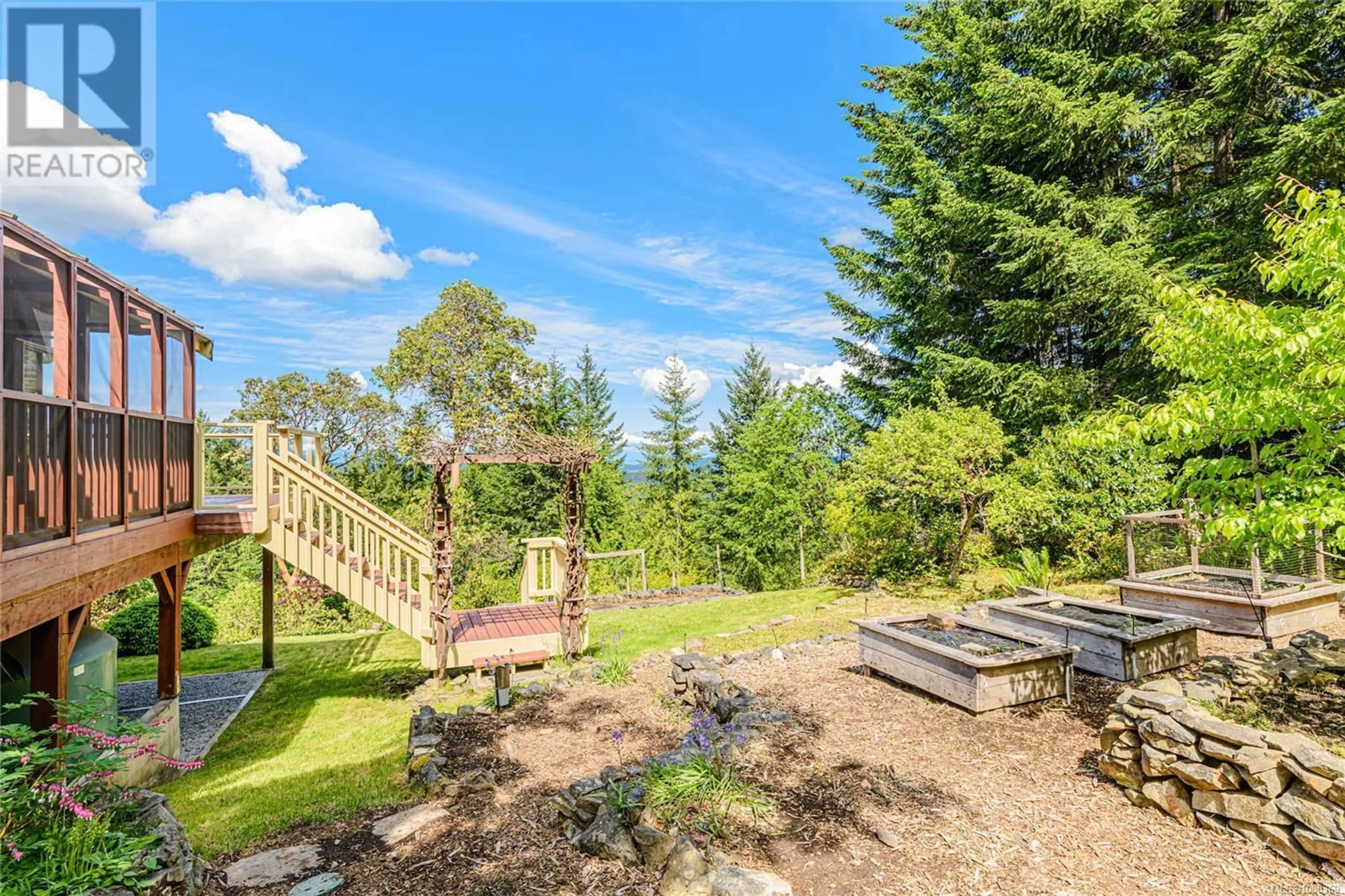 A pic from outside/outdoor area/front of a property/back of a property/a pic from drone, forest/trees view for 200 WILKIE WAY, Salt Spring British Columbia V8K2J4