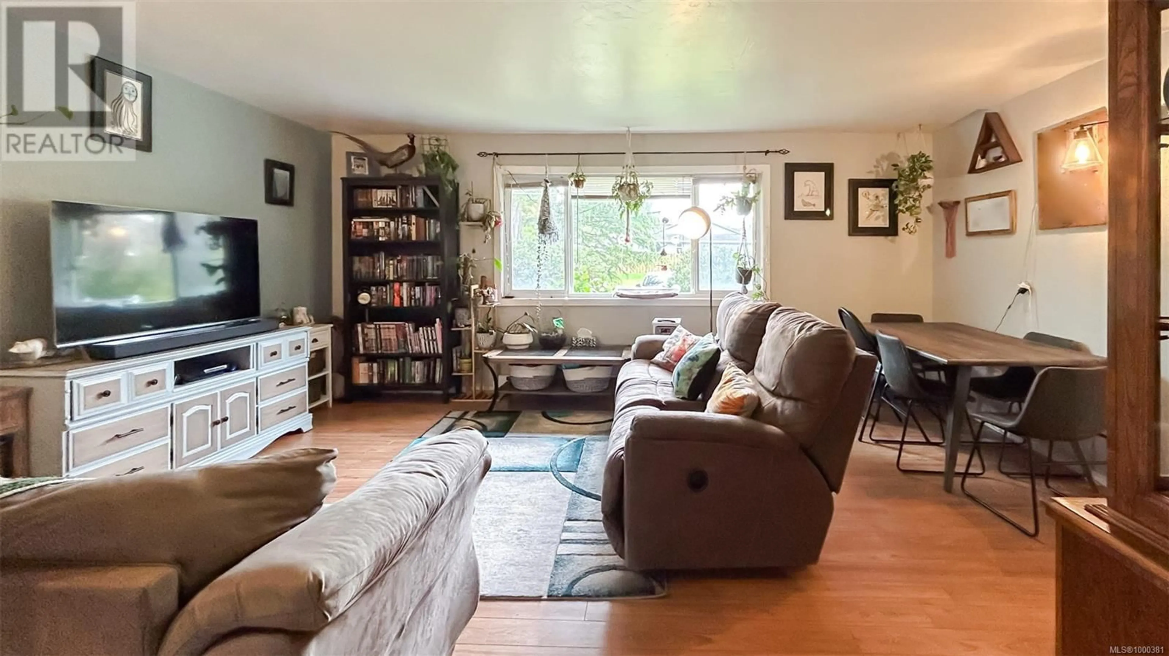 Living room with furniture, wood/laminate floor for 2159 FRENCH ROAD SOUTH, Sooke British Columbia V9Z0M7