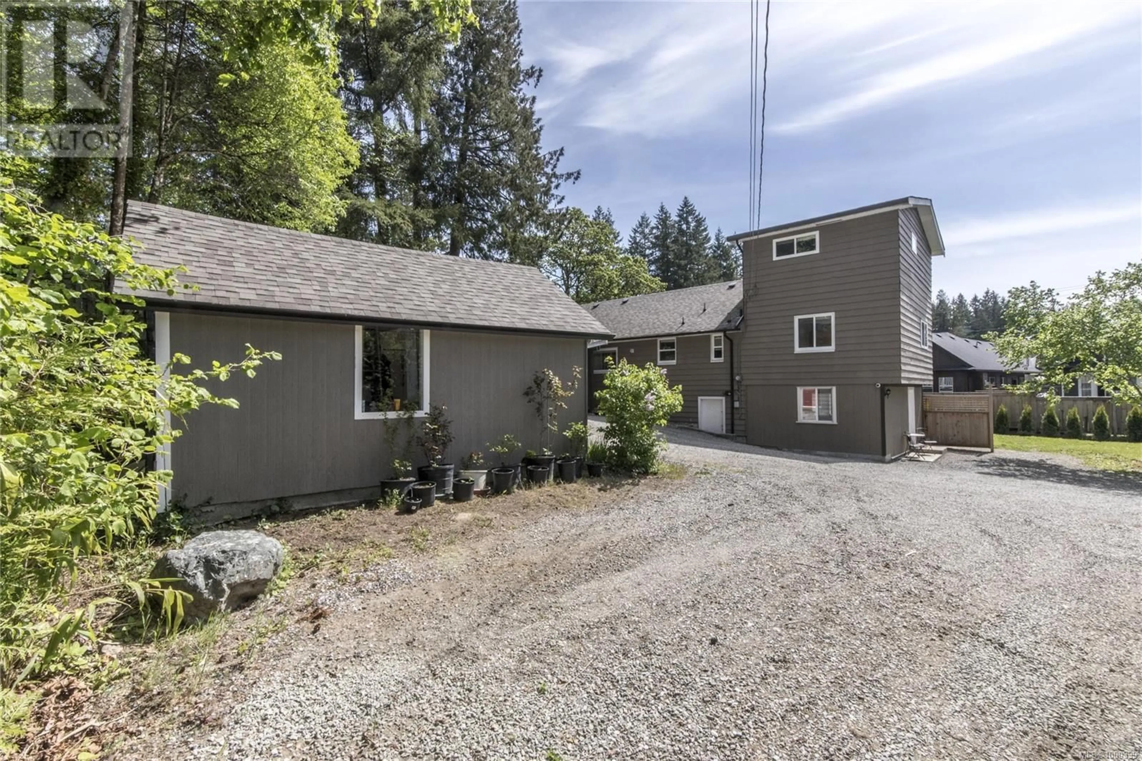 A pic from outside/outdoor area/front of a property/back of a property/a pic from drone, street for 3199 GIBBINS ROAD, Duncan British Columbia V9L1G7