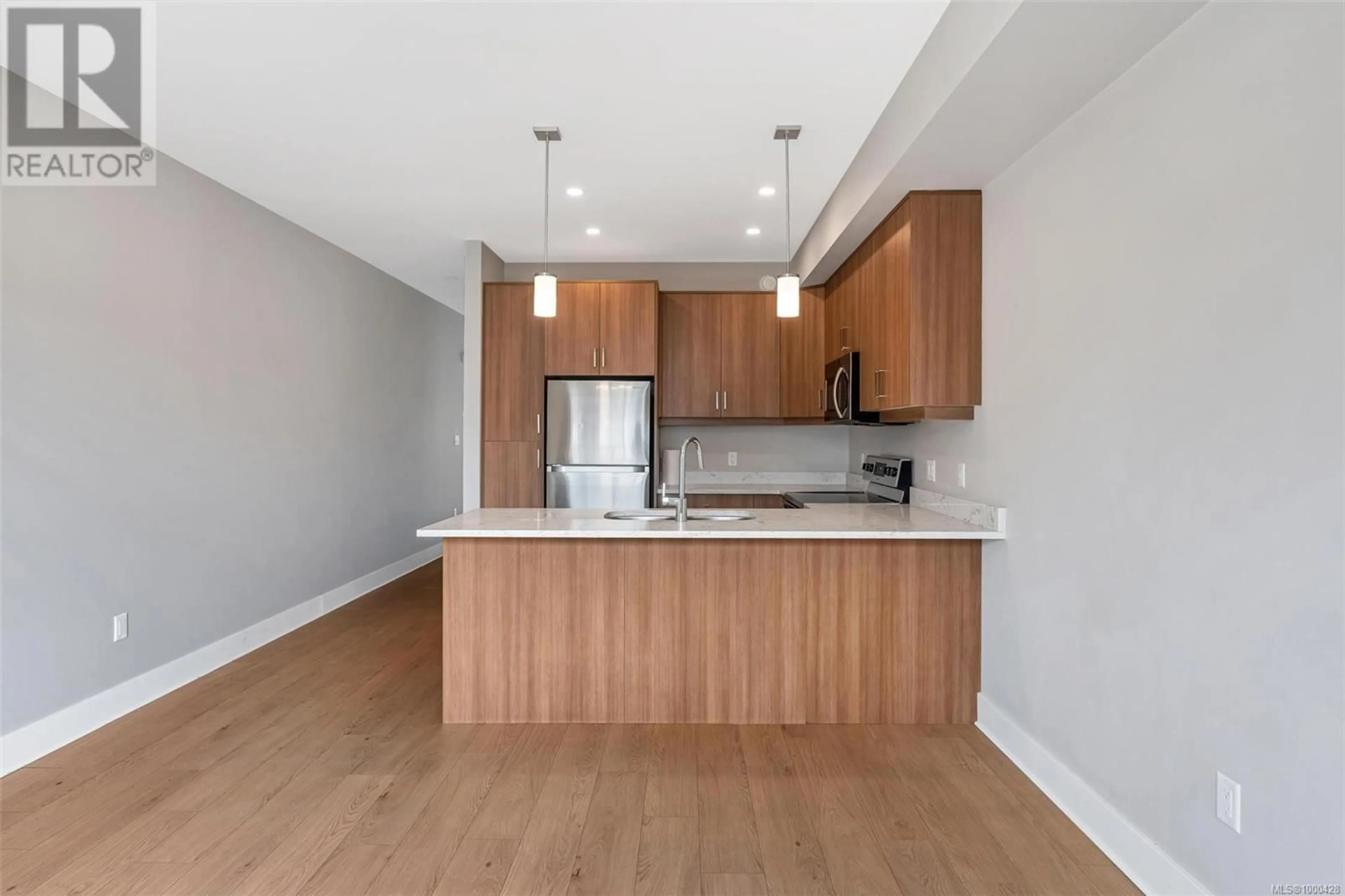 Open concept kitchen, wood/laminate floor for 951 WARBLER CLOSE, Langford British Columbia V9C0J4