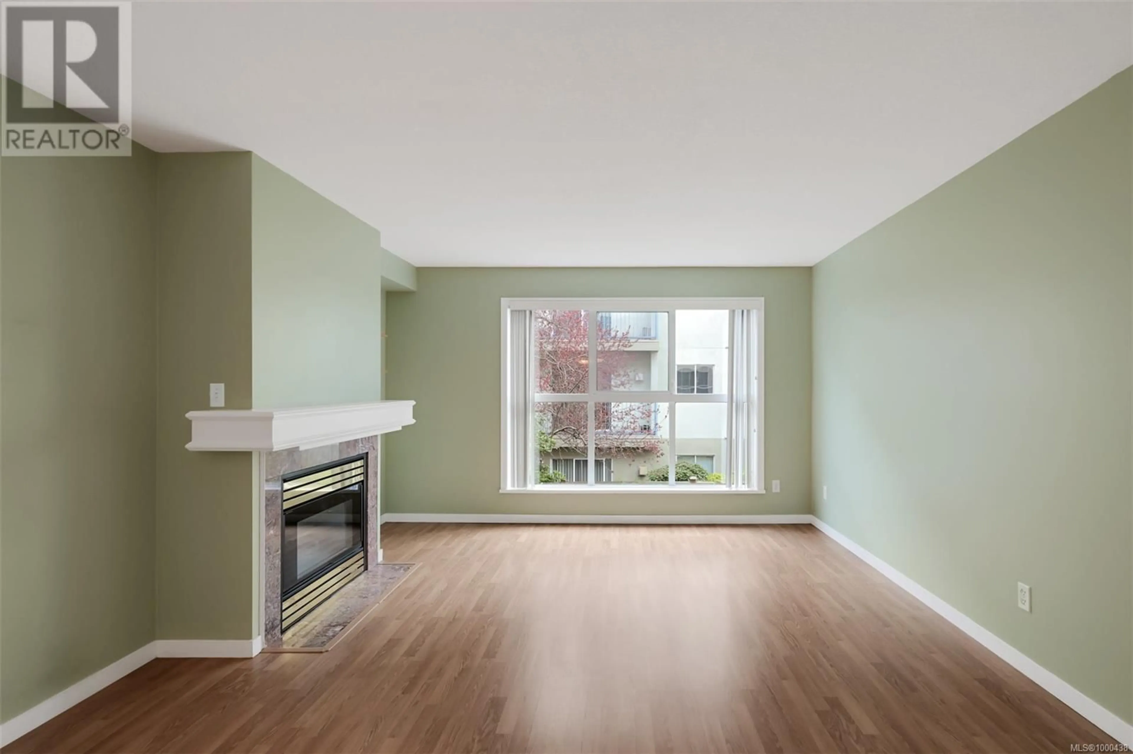 Living room with furniture, wood/laminate floor for 203 - 1710 FORT STREET, Victoria British Columbia V8R1J2