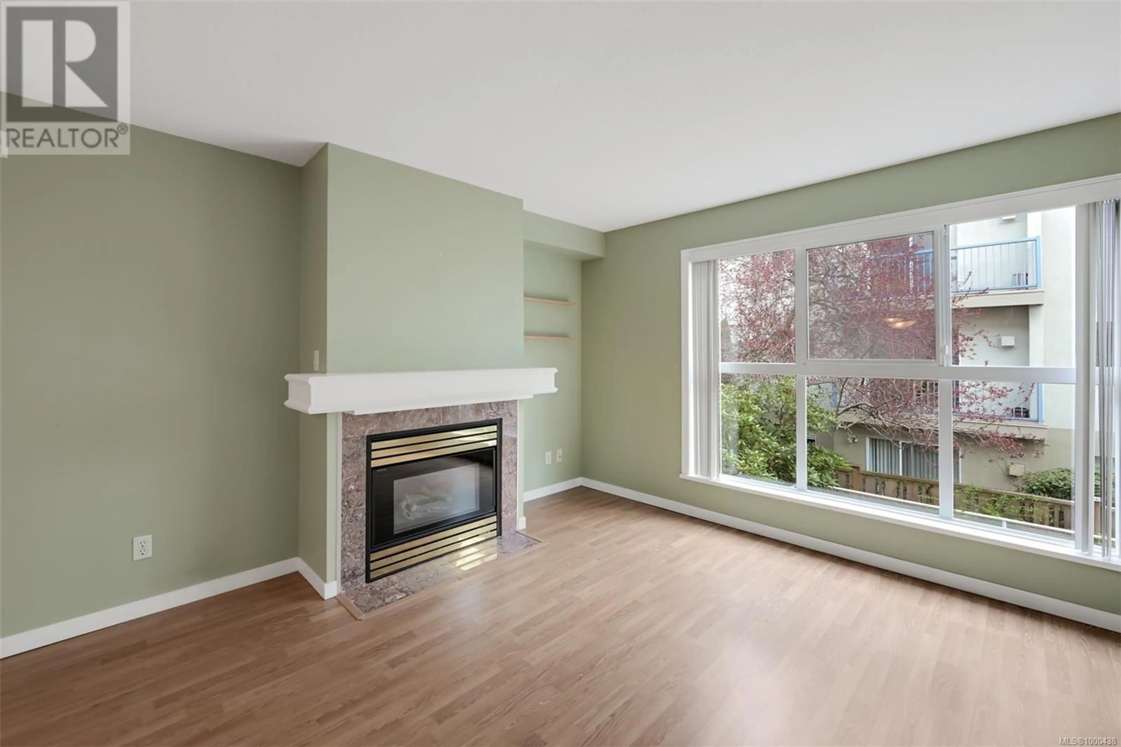 Living room with furniture, wood/laminate floor for 203 - 1710 FORT STREET, Victoria British Columbia V8R1J2