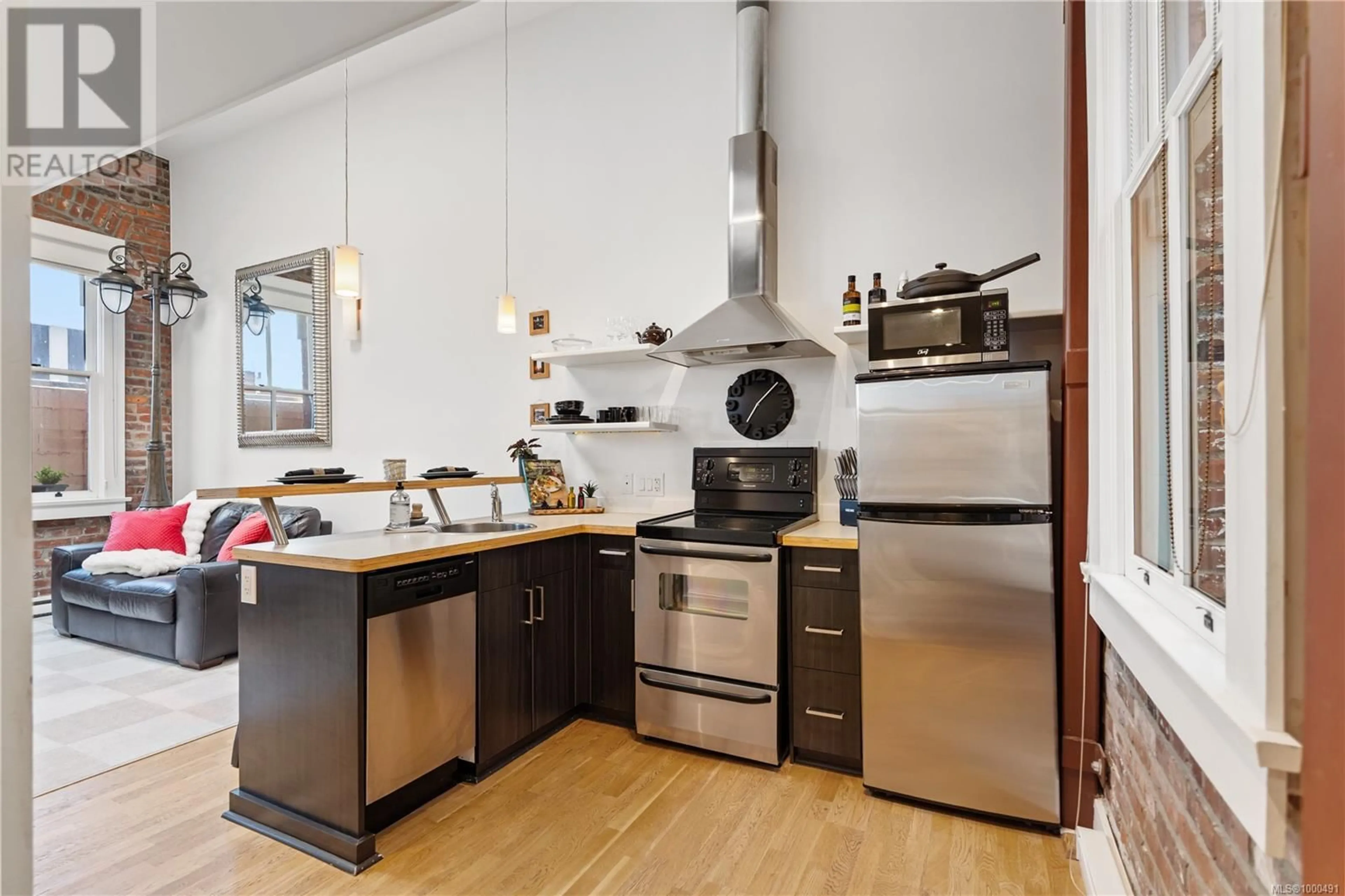 Open concept kitchen, wood/laminate floor for 308 - 562 YATES STREET, Victoria British Columbia V8W1K8