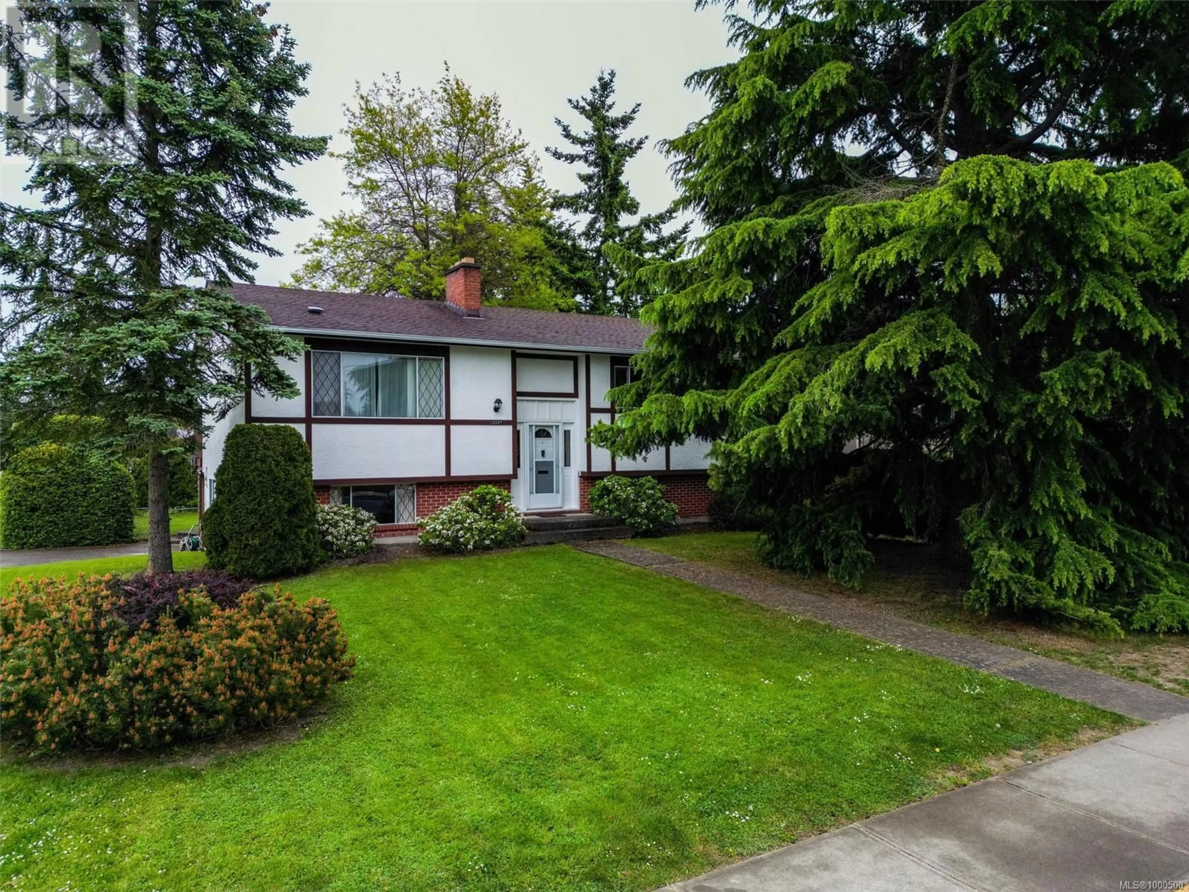 Home with vinyl exterior material, street for 10327 BOWERBANK ROAD, Sidney British Columbia V8L3L2