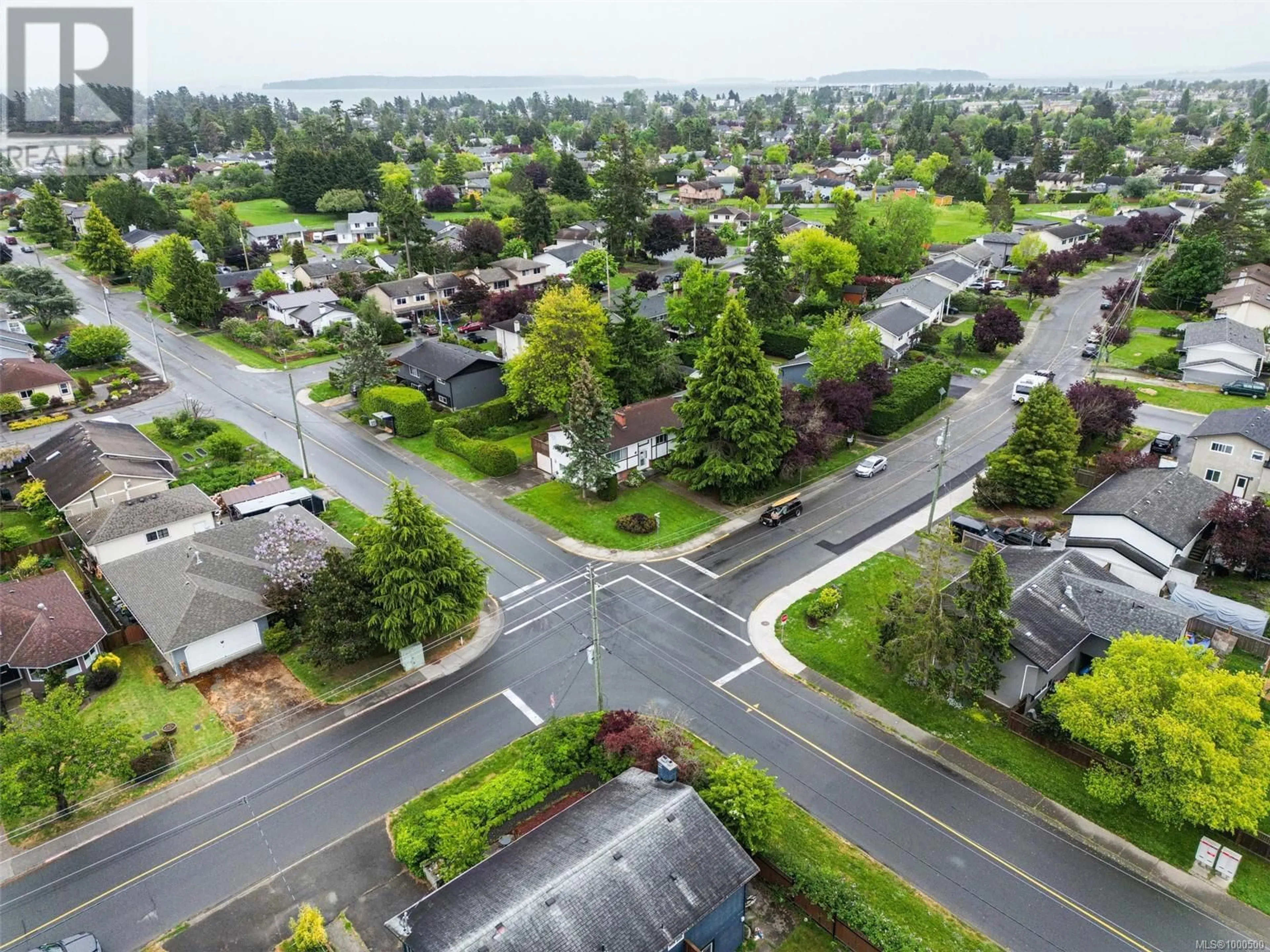 A pic from outside/outdoor area/front of a property/back of a property/a pic from drone, street for 10327 BOWERBANK ROAD, Sidney British Columbia V8L3L2