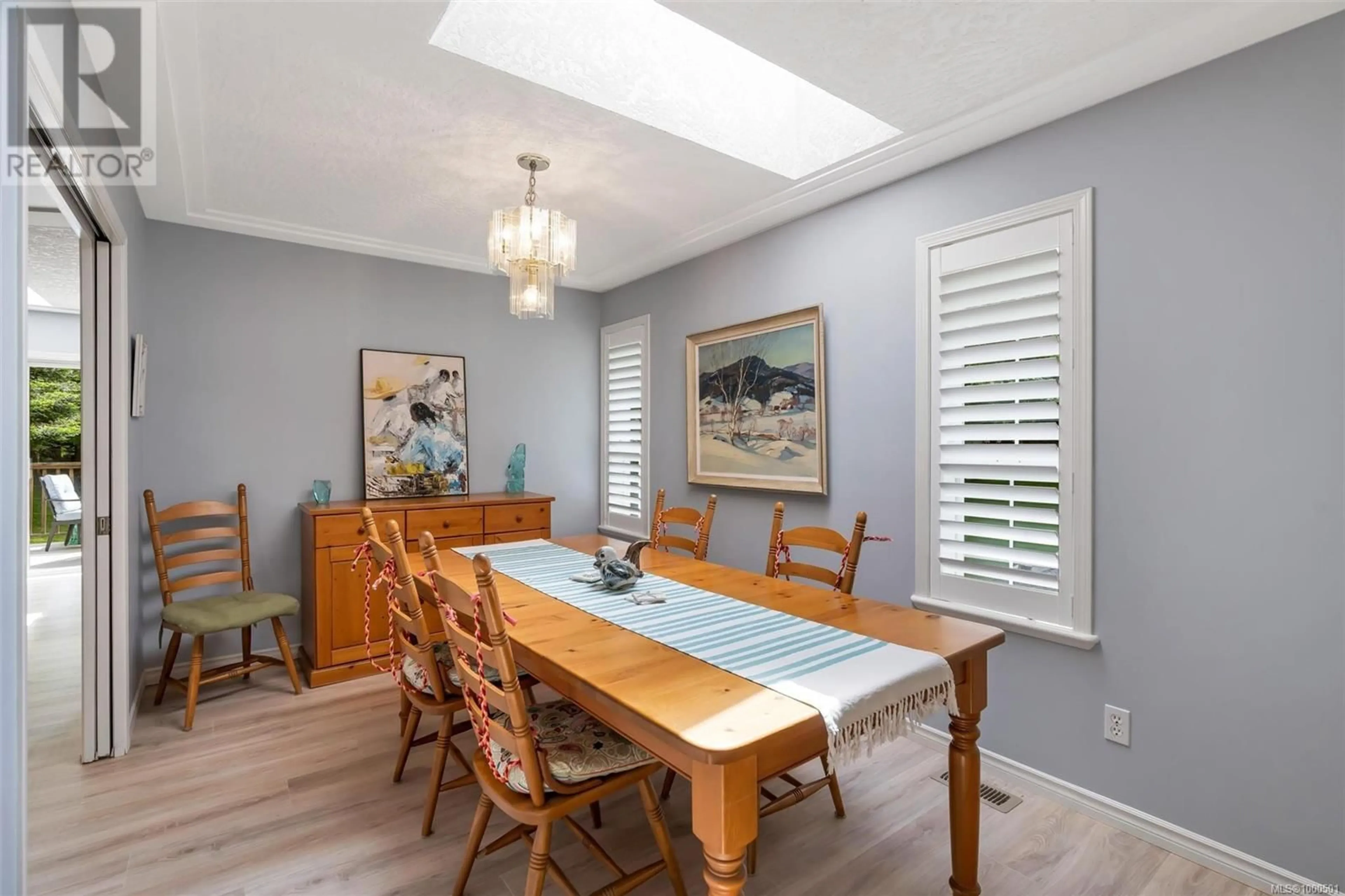 Dining room, wood/laminate floor for 2515 FAWN ROAD, Mill Bay British Columbia V8H1B2