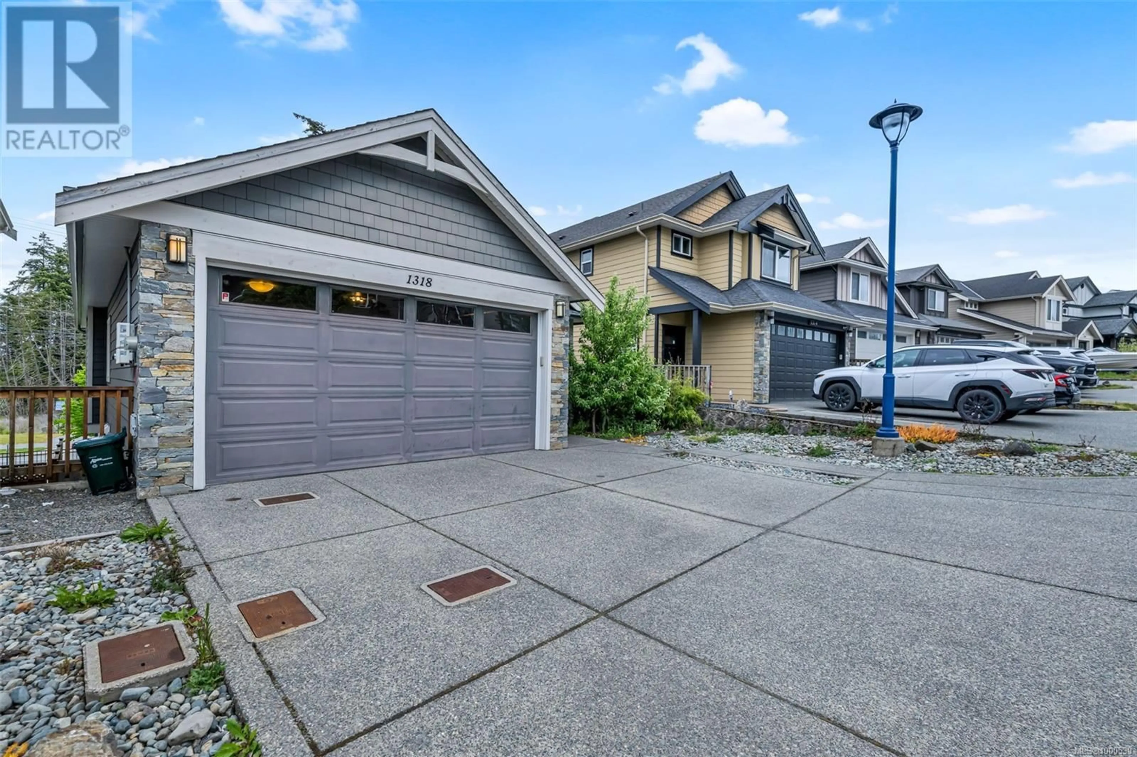 Home with vinyl exterior material, street for 1318 BOMBARDIER CRESCENT, Langford British Columbia V8Z5A3