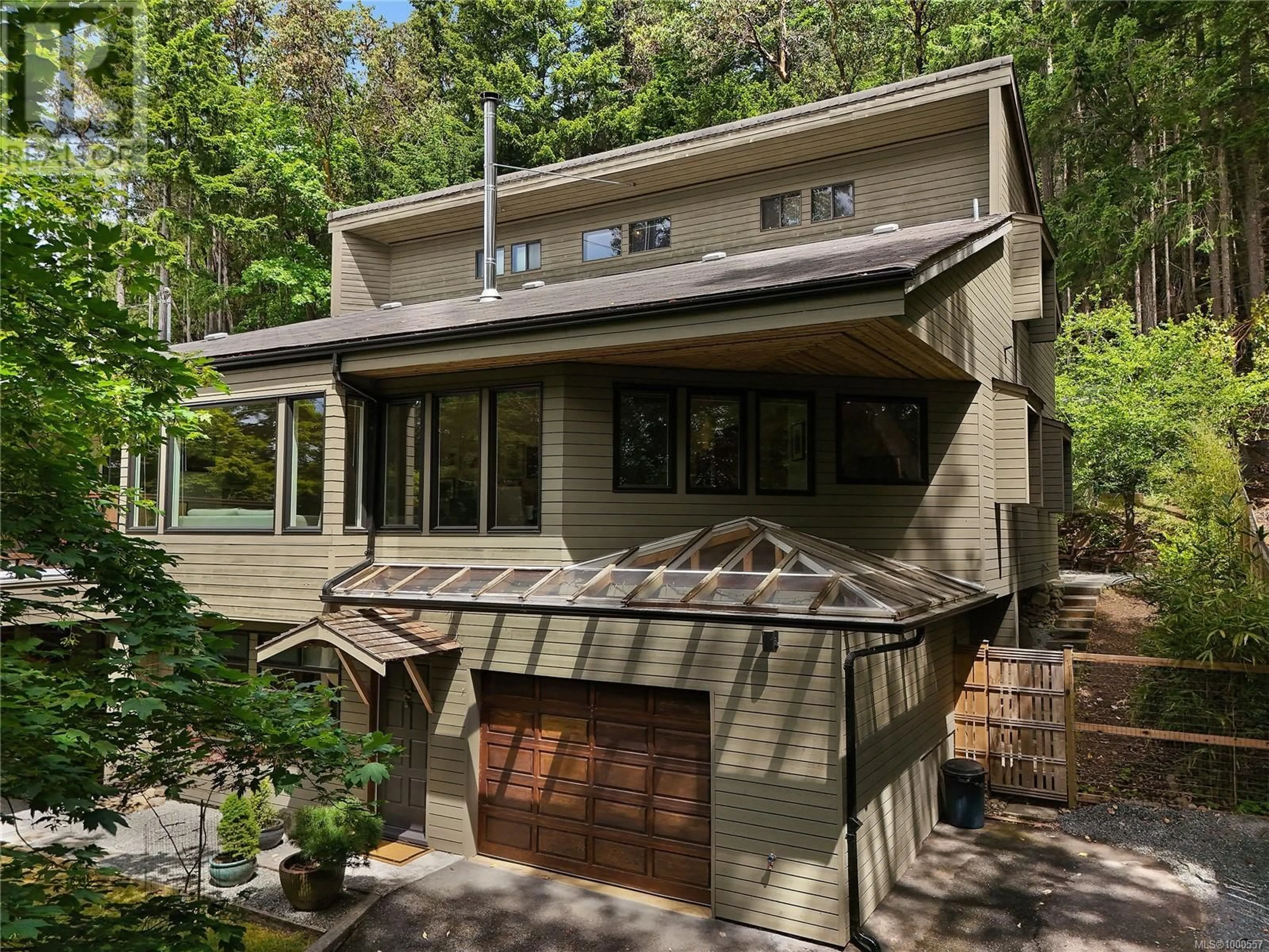 Home with vinyl exterior material, street for 297 WOOD DALE DRIVE, Mayne Island British Columbia V0N2J2