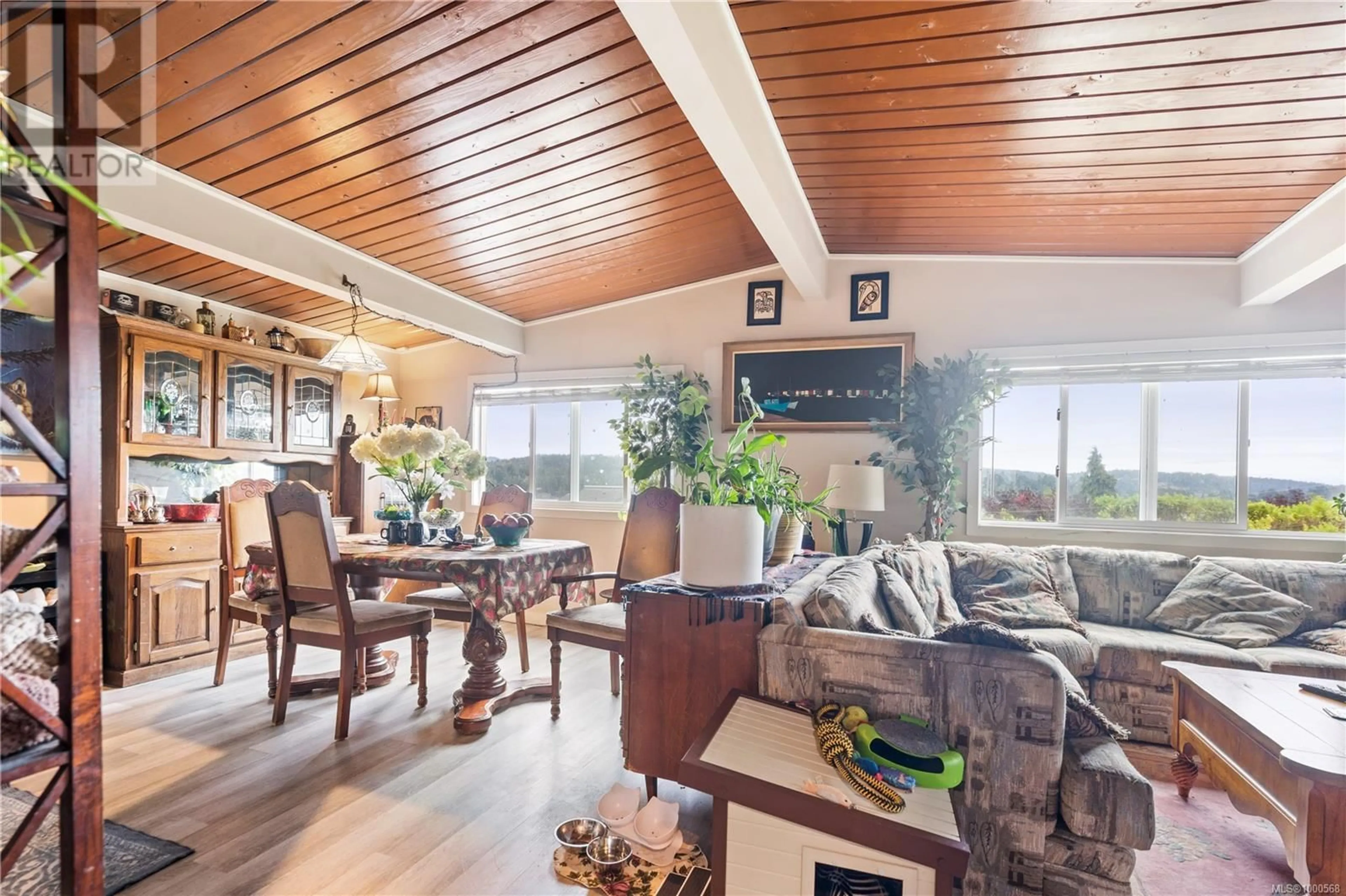 Living room with furniture, wood/laminate floor for 6558 LANARK ROAD, Sooke British Columbia V9Z0X1