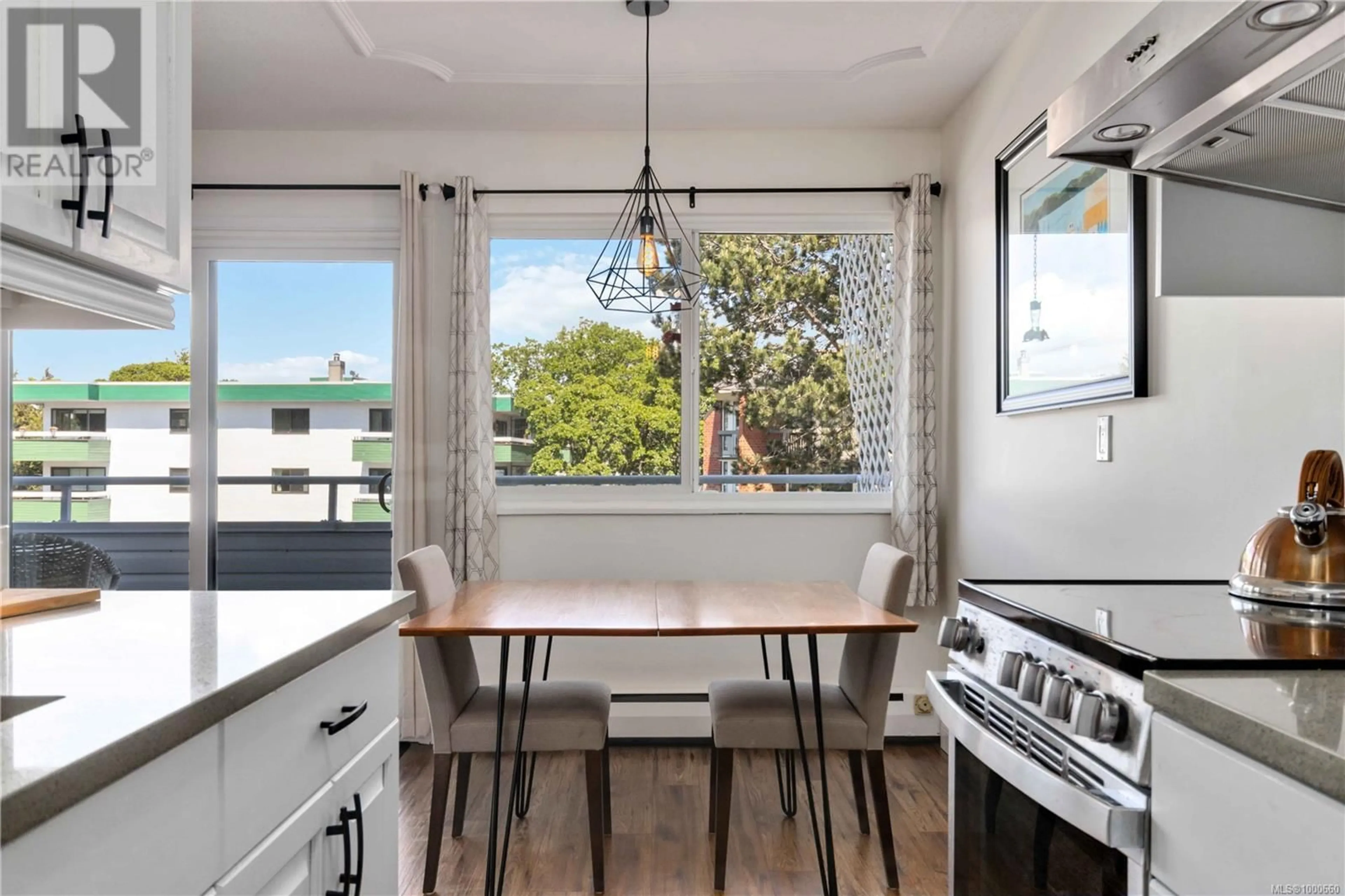 Open concept kitchen, wood/laminate floor for 215 - 2100 GRANITE STREET, Oak Bay British Columbia V8S3G7