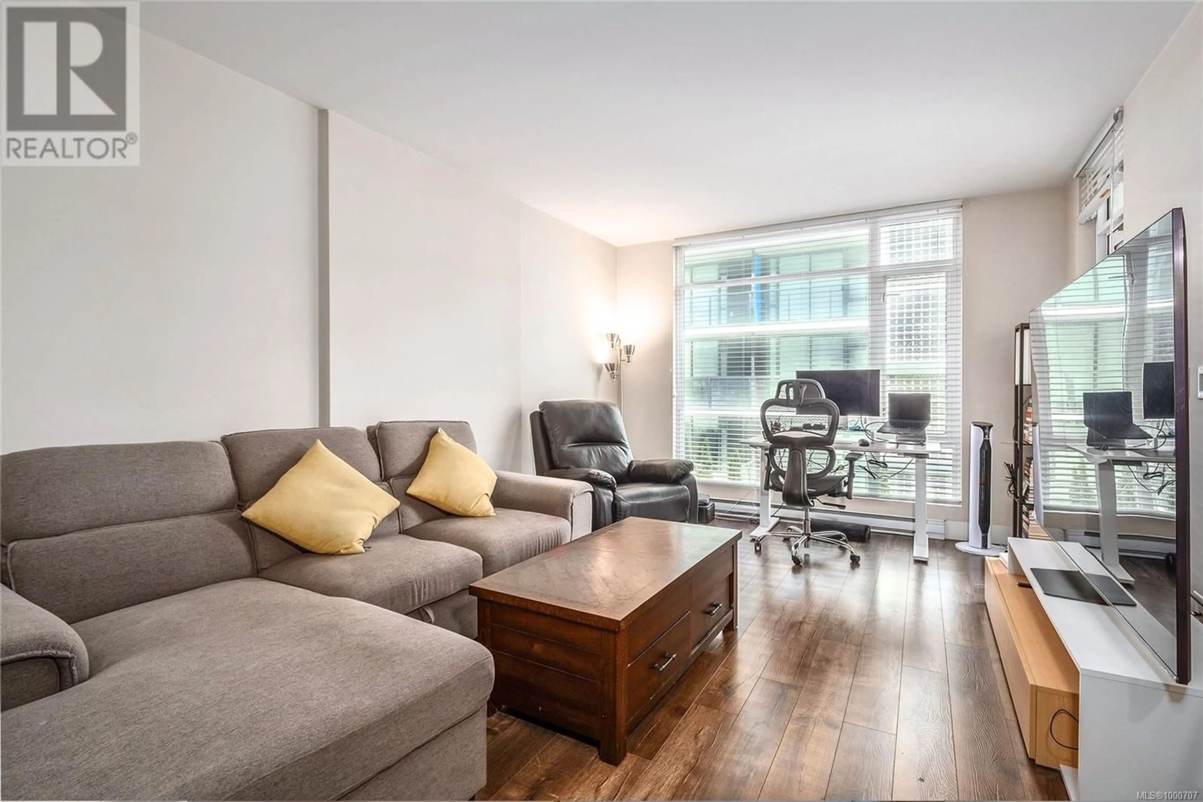 Living room with furniture, wood/laminate floor for 408 - 1090 JOHNSON STREET, Victoria British Columbia V8V3P6