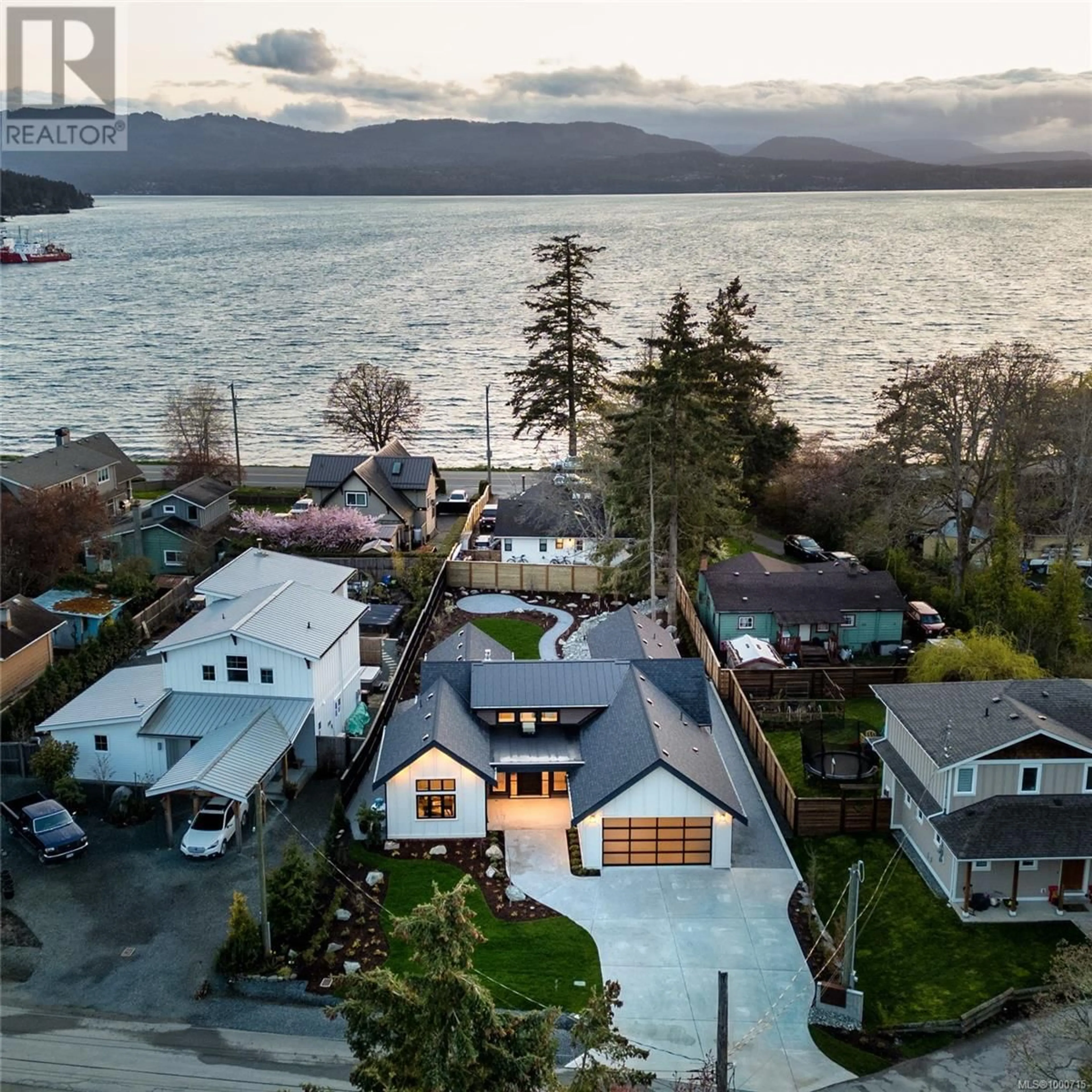 A pic from outside/outdoor area/front of a property/back of a property/a pic from drone, water/lake/river/ocean view for 10210 TSAYKUM ROAD, North Saanich British Columbia V8L5T6