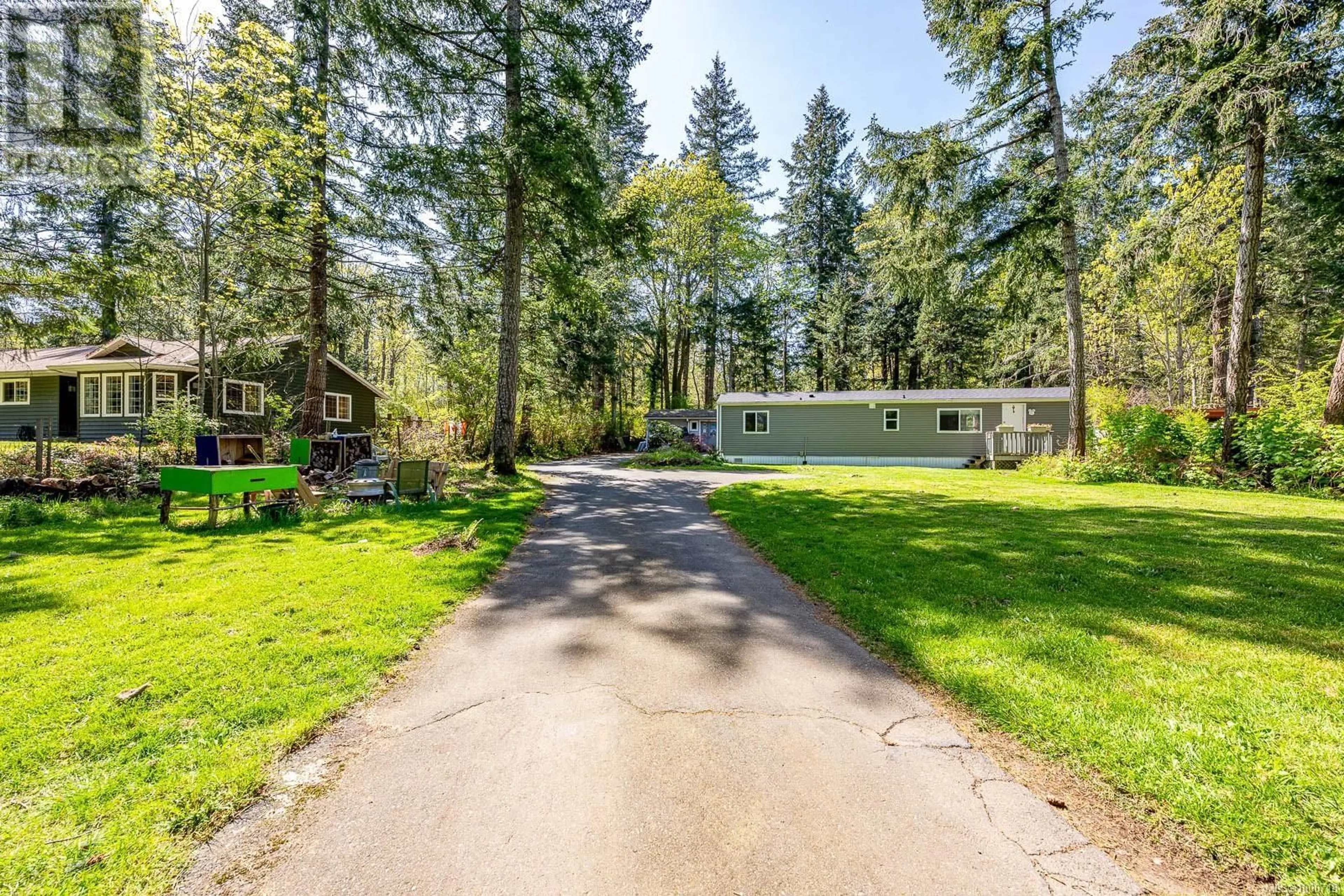 A pic from outside/outdoor area/front of a property/back of a property/a pic from drone, forest/trees view for 5895 BATES ROAD, Courtenay British Columbia V9J1W6