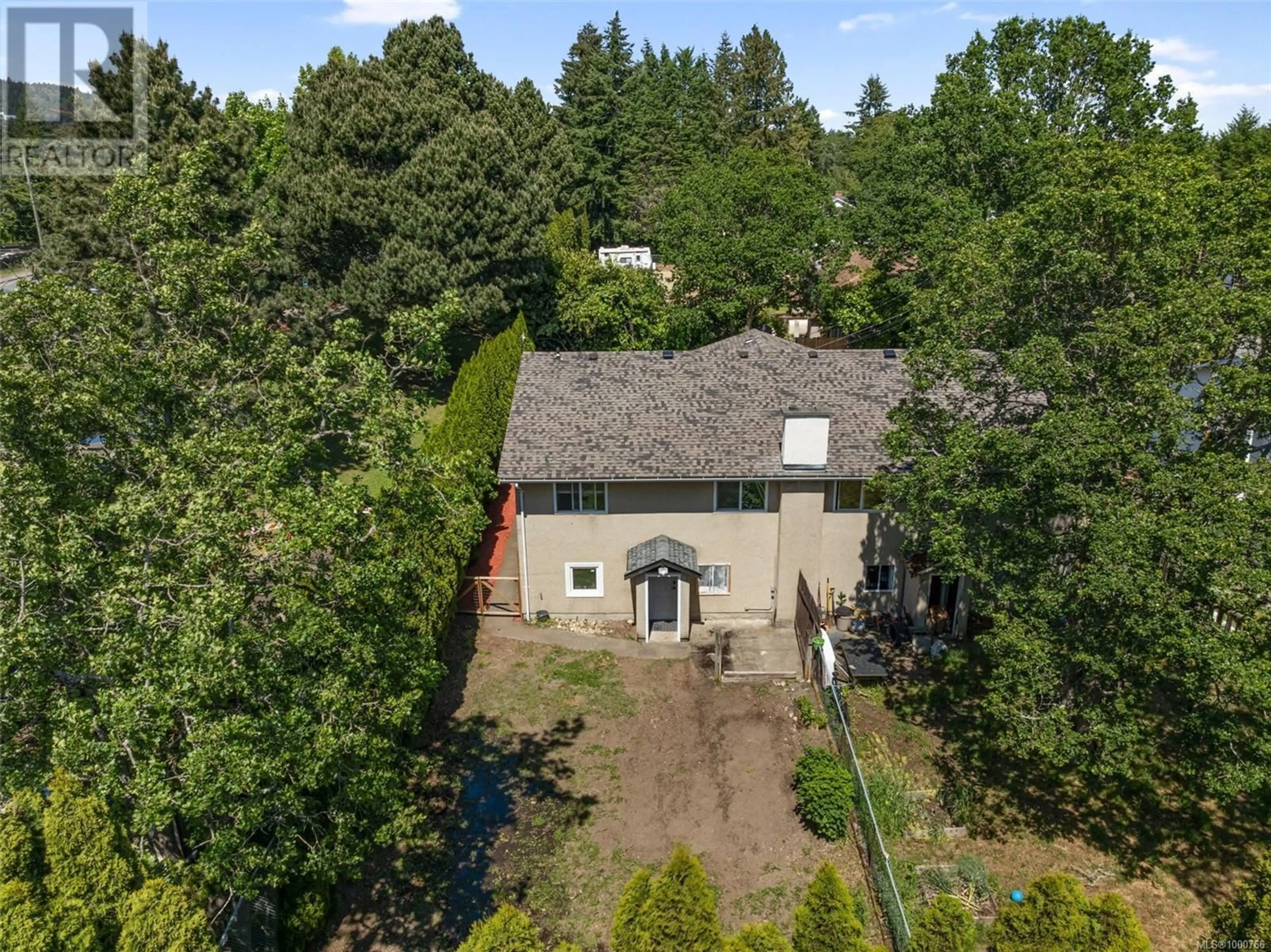 A pic from outside/outdoor area/front of a property/back of a property/a pic from drone, forest/trees view for 999 FURBER ROAD, Langford British Columbia V9B2T6