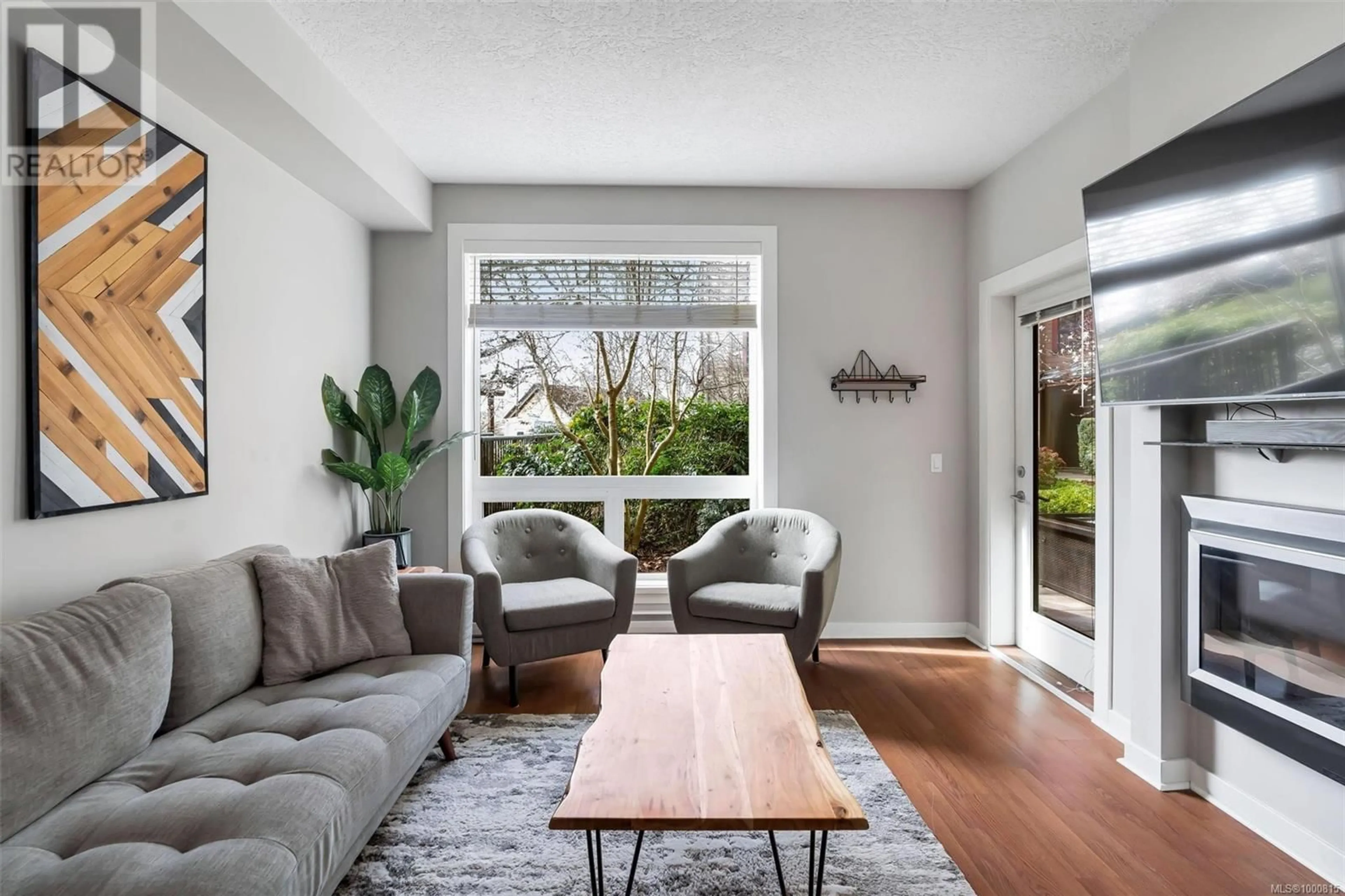 Living room with furniture, unknown for 107 - 4529 WEST SAANICH ROAD, Saanich British Columbia V8Z3G3