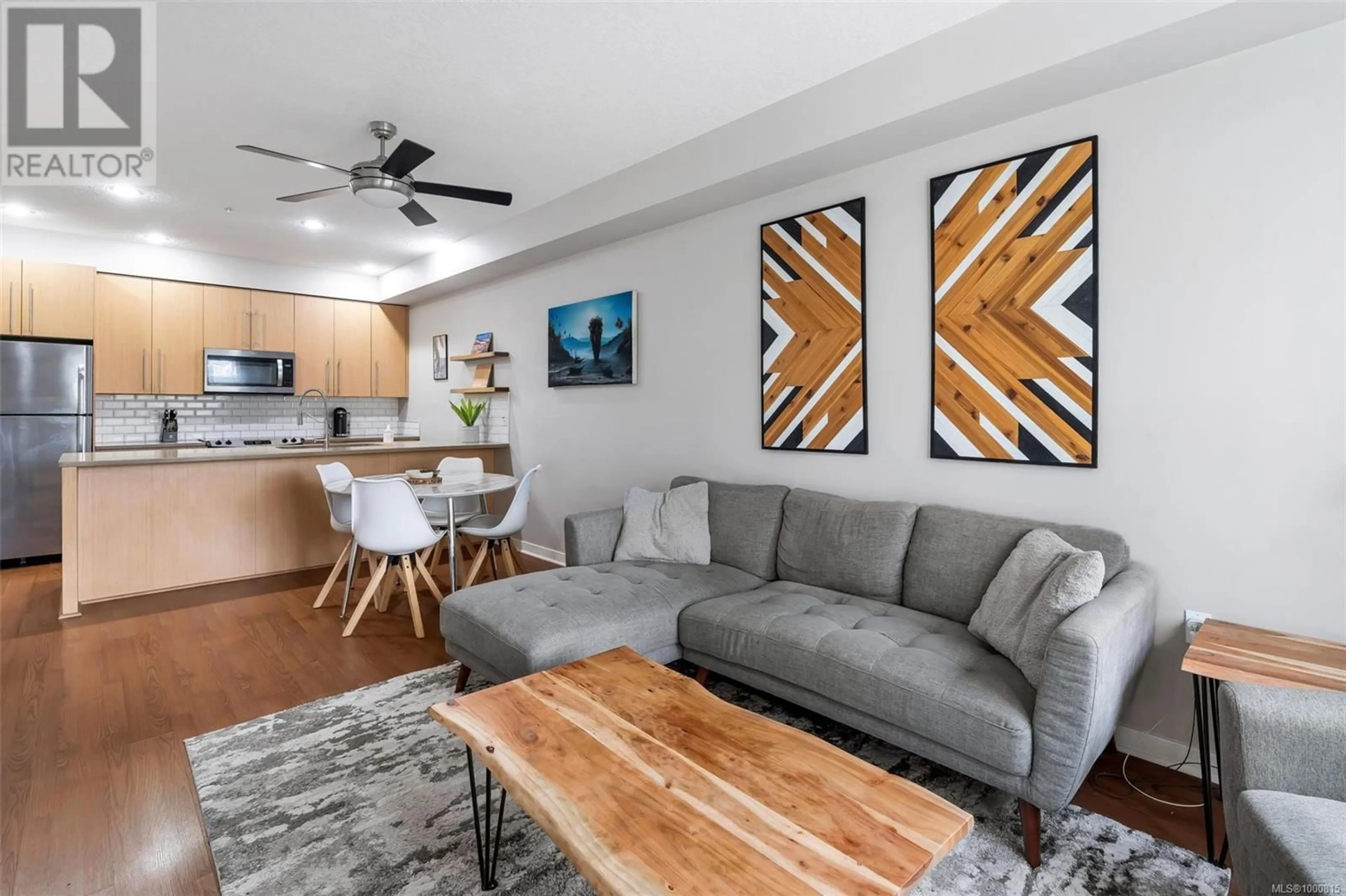 Living room with furniture, unknown for 107 - 4529 WEST SAANICH ROAD, Saanich British Columbia V8Z3G3