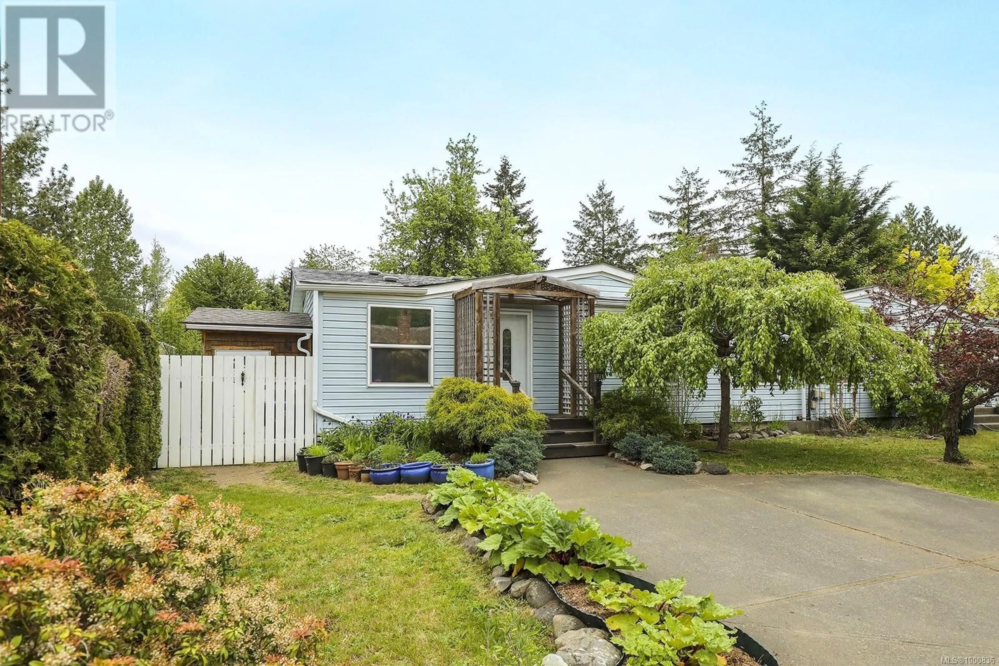 Home with vinyl exterior material, street for A - 1680 BURGESS ROAD, Courtenay British Columbia V9N5W8
