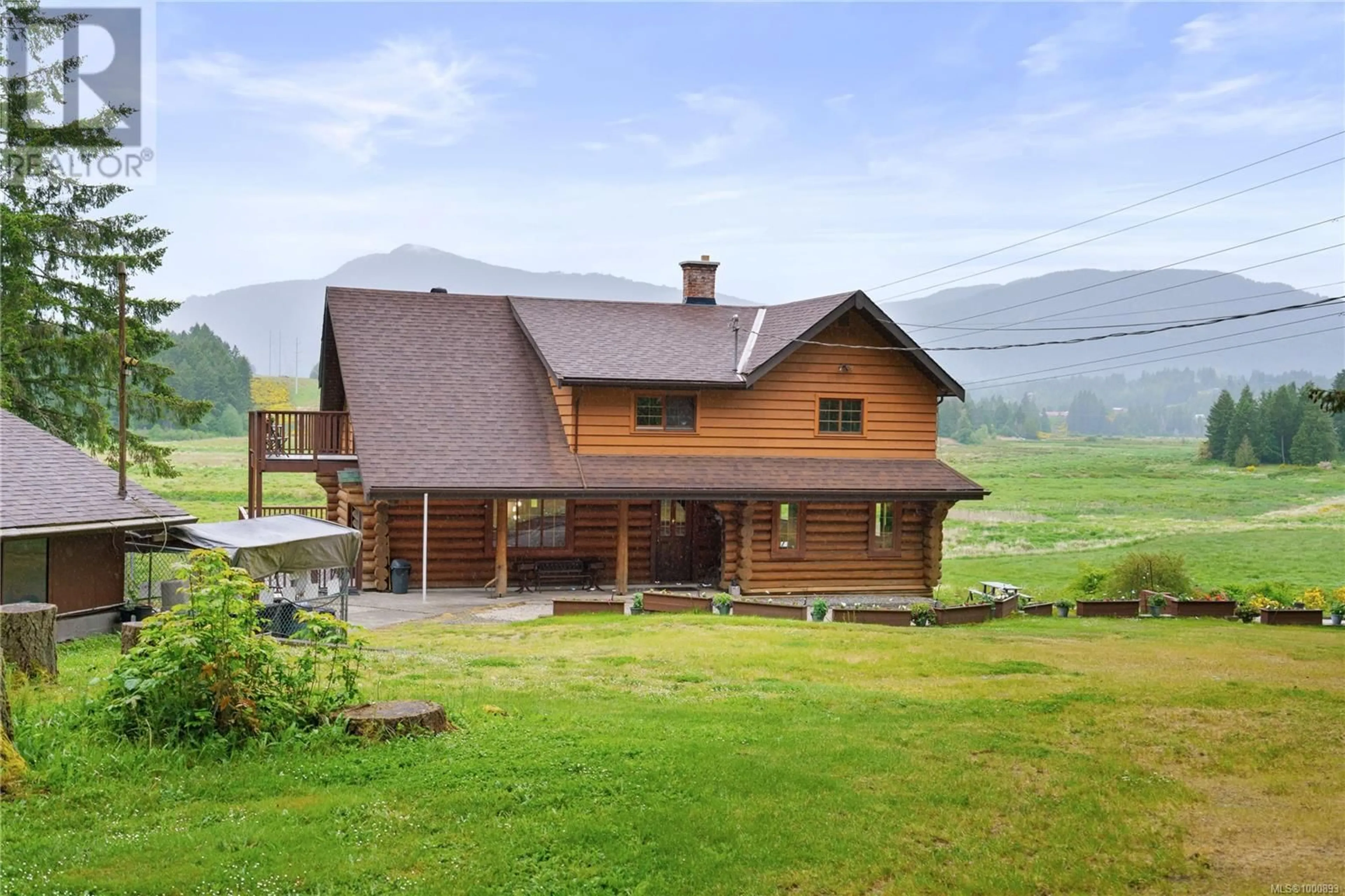 A pic from outside/outdoor area/front of a property/back of a property/a pic from drone, mountain view for 7038 TOM WINDSOR ROAD, Duncan British Columbia V9L5W3