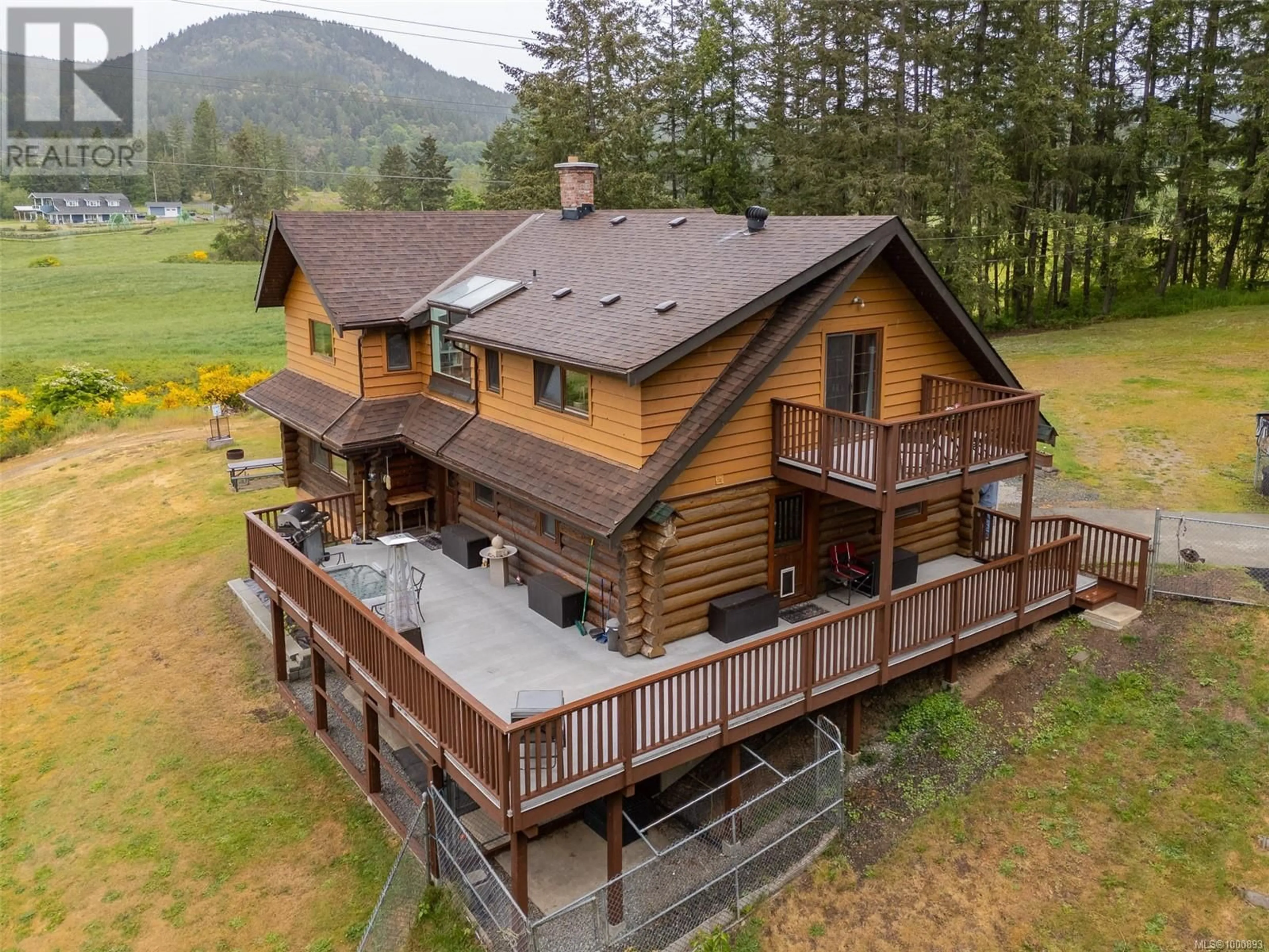 A pic from outside/outdoor area/front of a property/back of a property/a pic from drone, mountain view for 7038 TOM WINDSOR ROAD, Duncan British Columbia V9L5W3