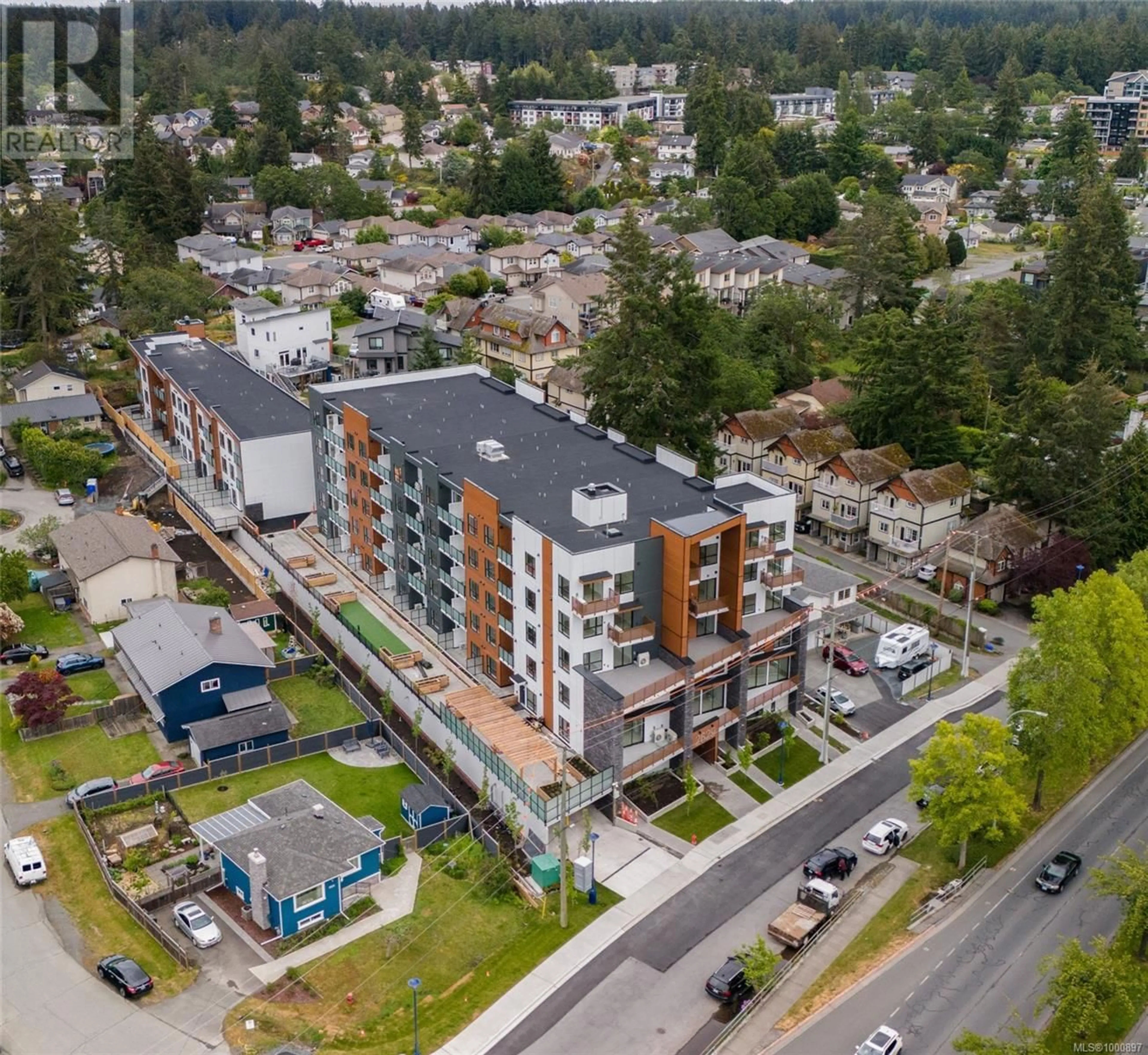 A pic from outside/outdoor area/front of a property/back of a property/a pic from drone, street for 405 - 2629 MILLSTREAM ROAD, Langford British Columbia V9B3R8