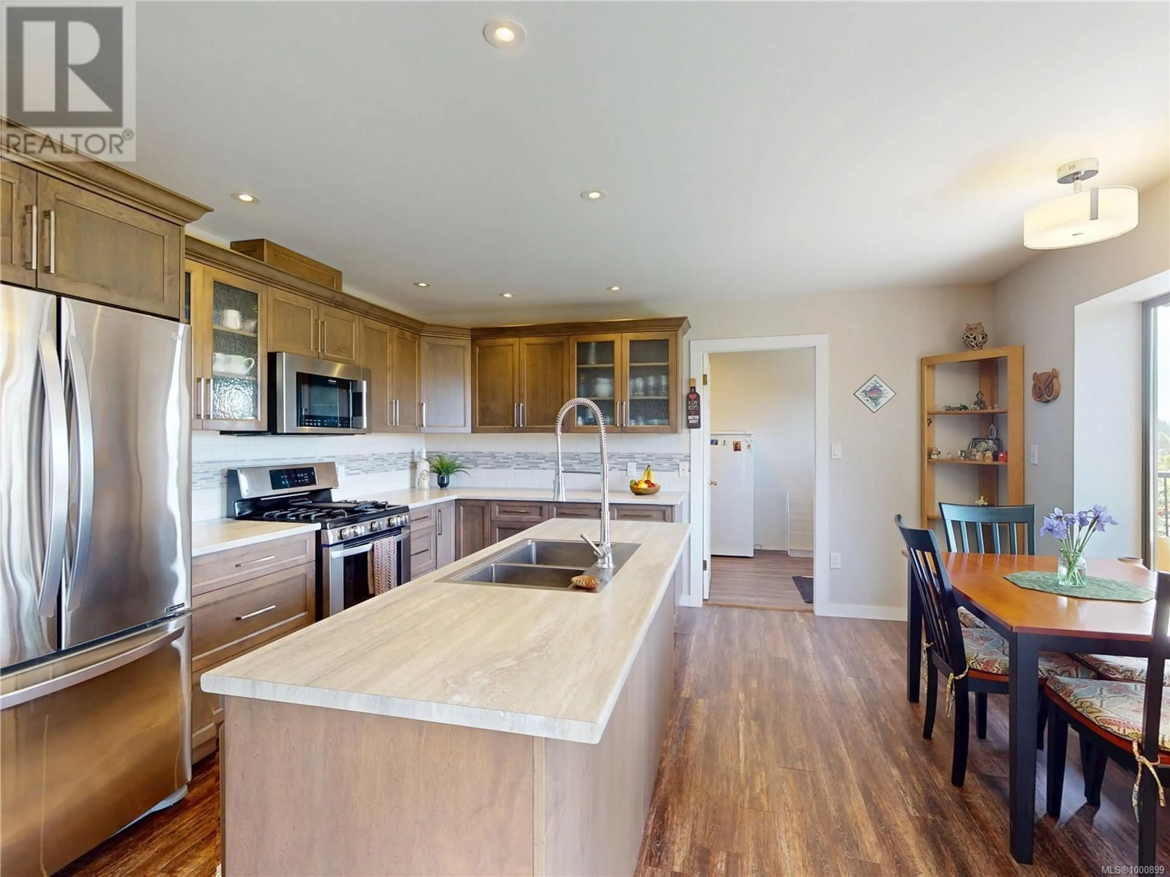 Open concept kitchen, wood/laminate floor for 1783 BARRETT DRIVE, North Saanich British Columbia V8L4V1
