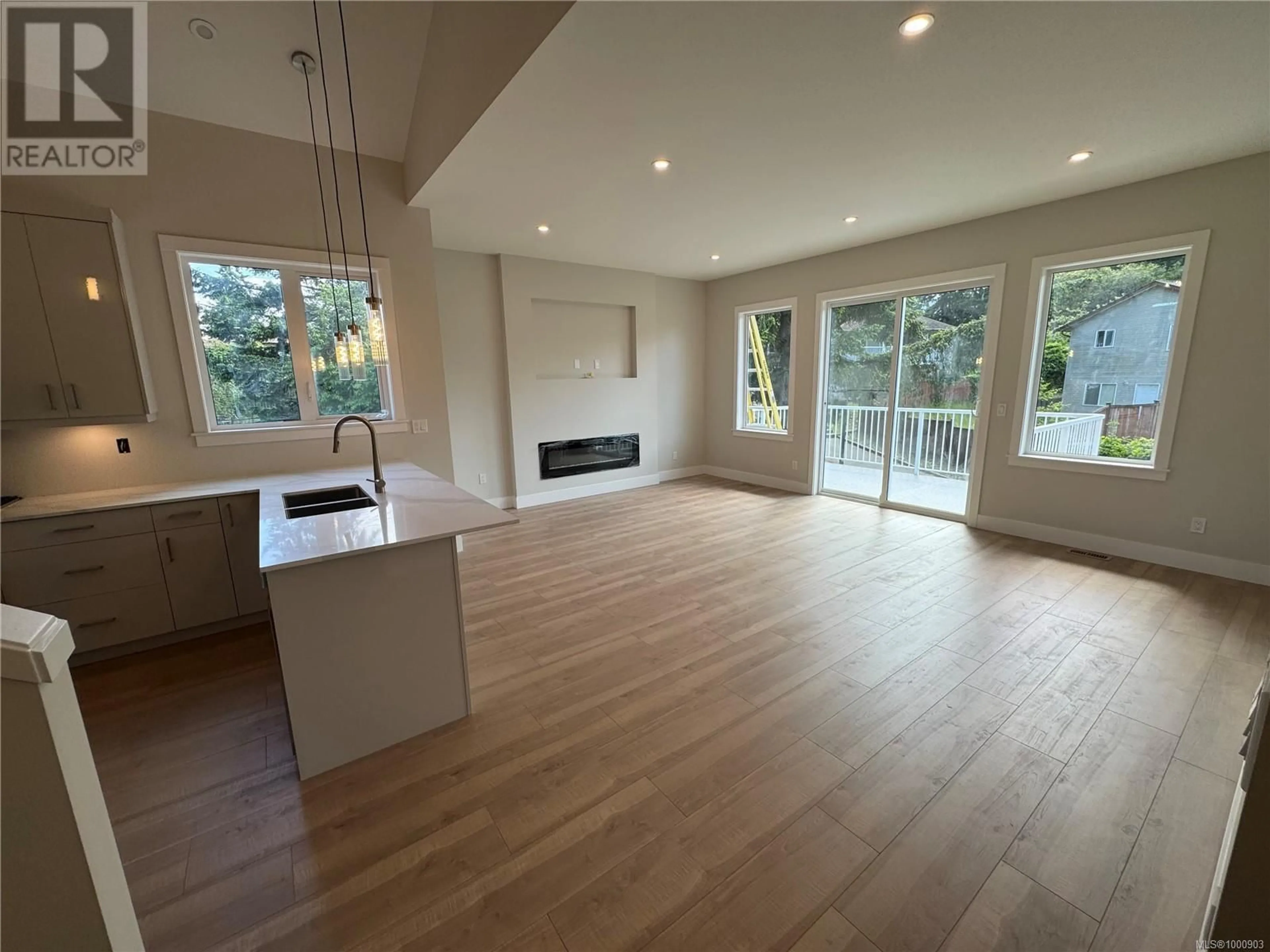 Open concept kitchen, wood/laminate floor for 19 LEAM ROAD, Nanaimo British Columbia V9T3N7