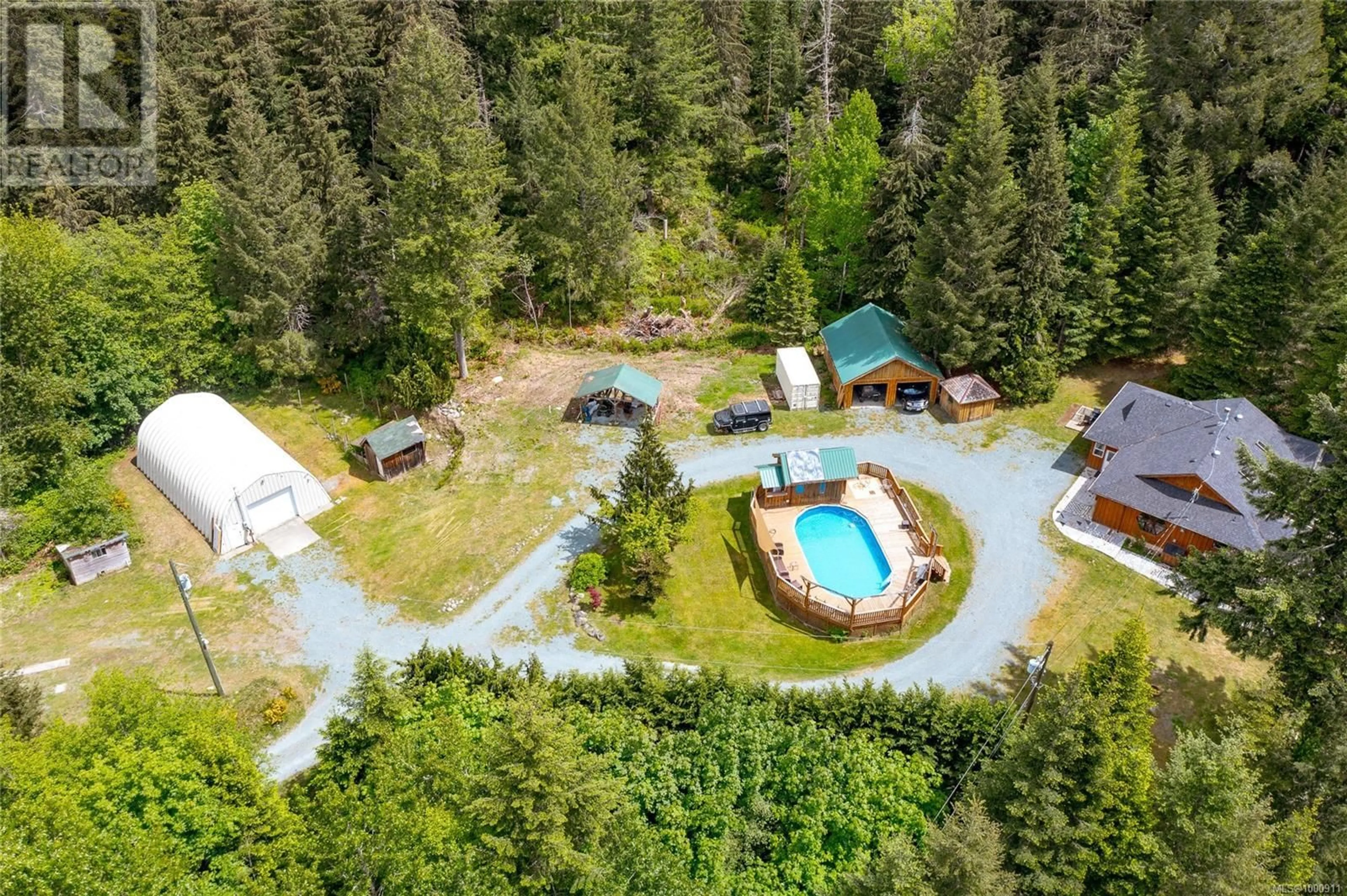 A pic from outside/outdoor area/front of a property/back of a property/a pic from drone, forest/trees view for 5982 MAYO ROAD, Lake Cowichan British Columbia V0R2G0