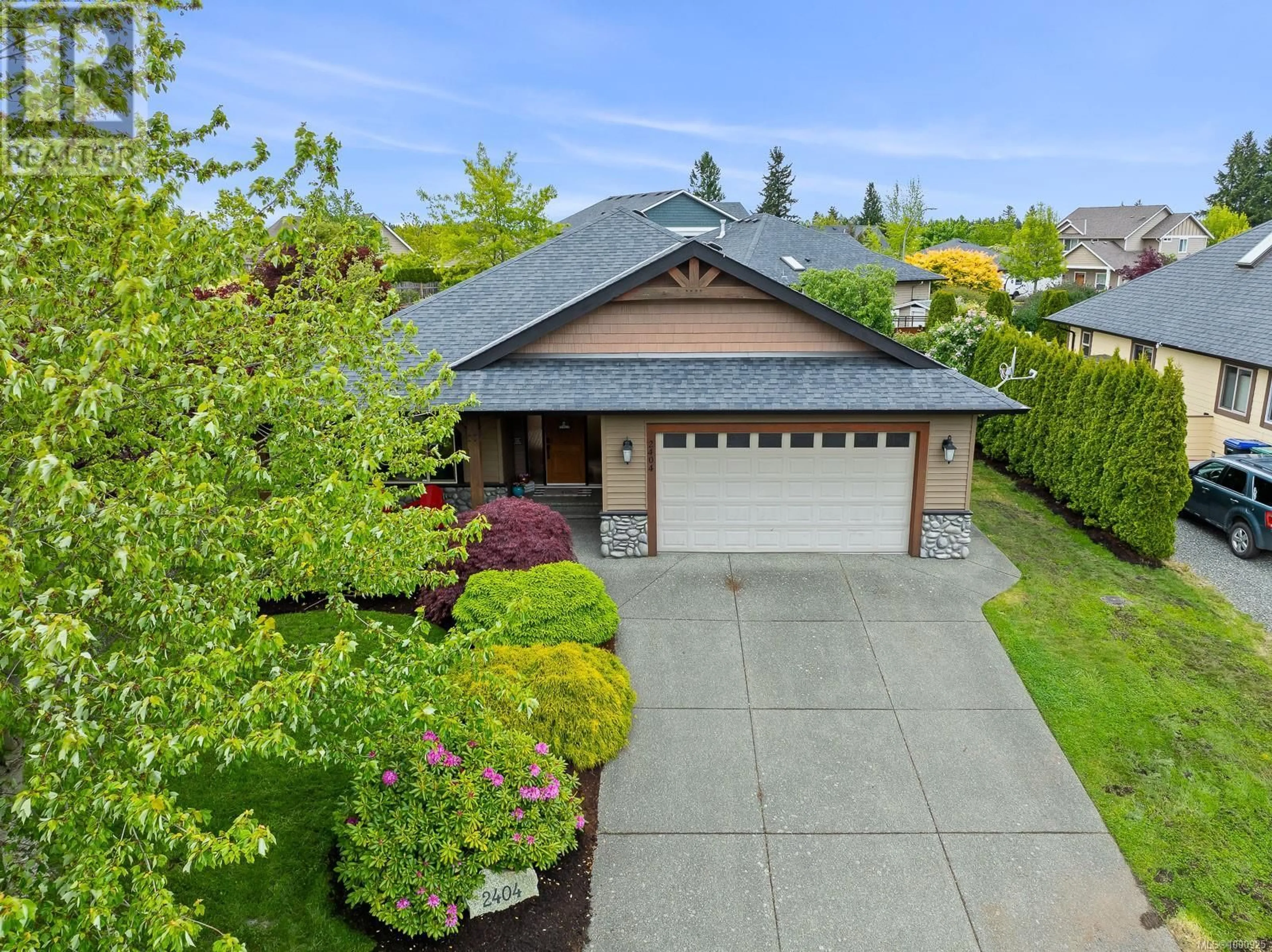A pic from outside/outdoor area/front of a property/back of a property/a pic from drone, street for 2404 TUTOR DRIVE, Comox British Columbia V9M0A7