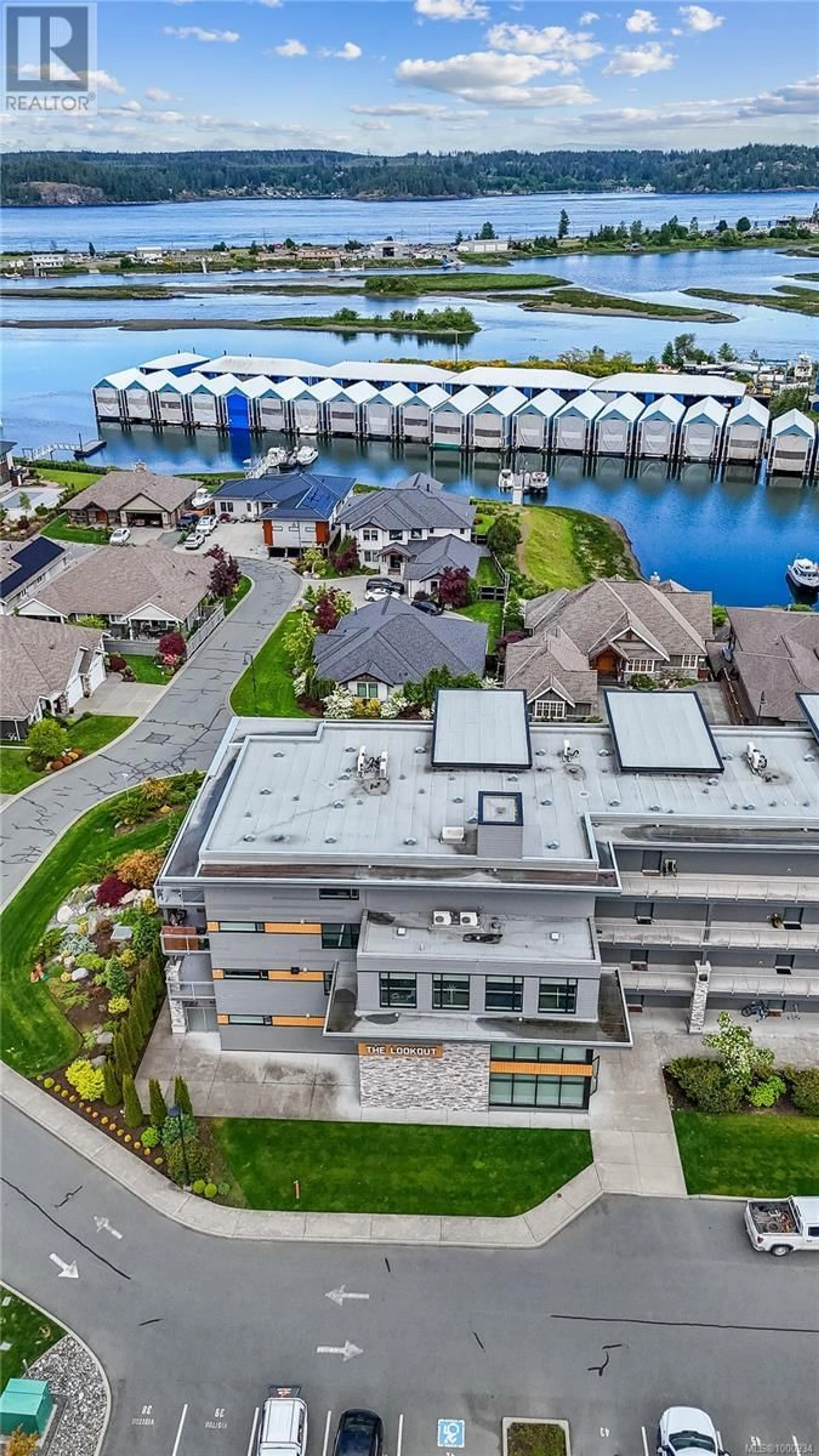 A pic from outside/outdoor area/front of a property/back of a property/a pic from drone, water/lake/river/ocean view for 104 - 2777 NORTH BEACH DRIVE, Campbell River British Columbia V9W0B5