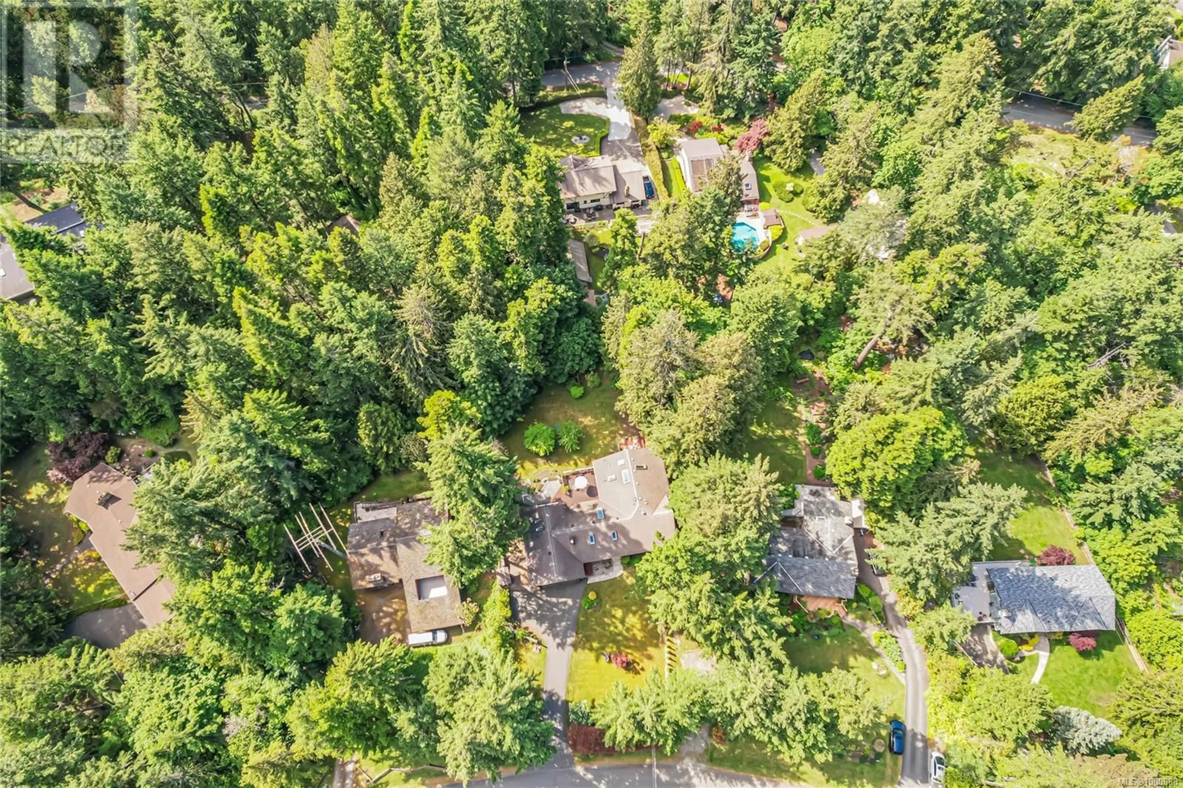 A pic from outside/outdoor area/front of a property/back of a property/a pic from drone, forest/trees view for 9486 GLENELG AVENUE, North Saanich British Columbia V8L5G9
