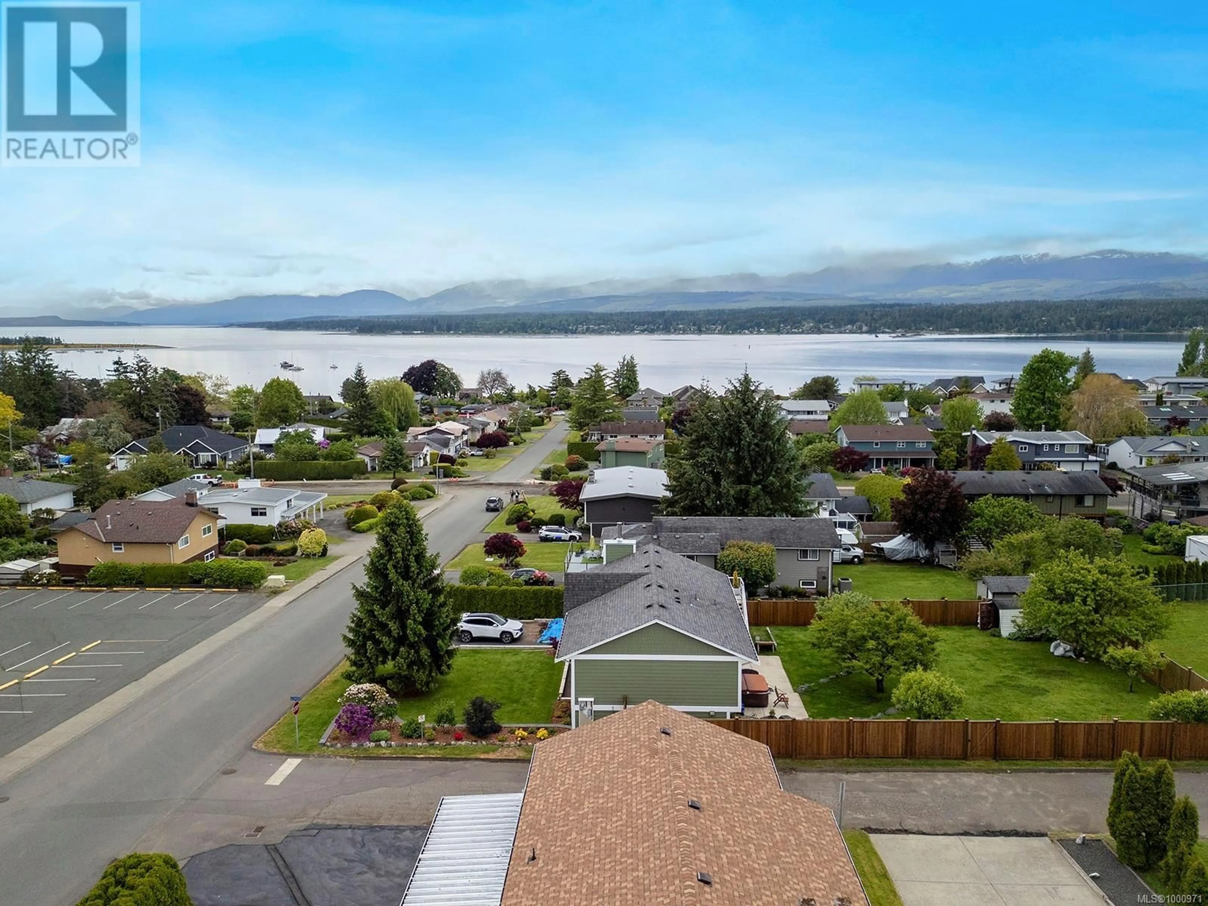 A pic from outside/outdoor area/front of a property/back of a property/a pic from drone, water/lake/river/ocean view for 251 BEACH DRIVE, Comox British Columbia V9N1W3