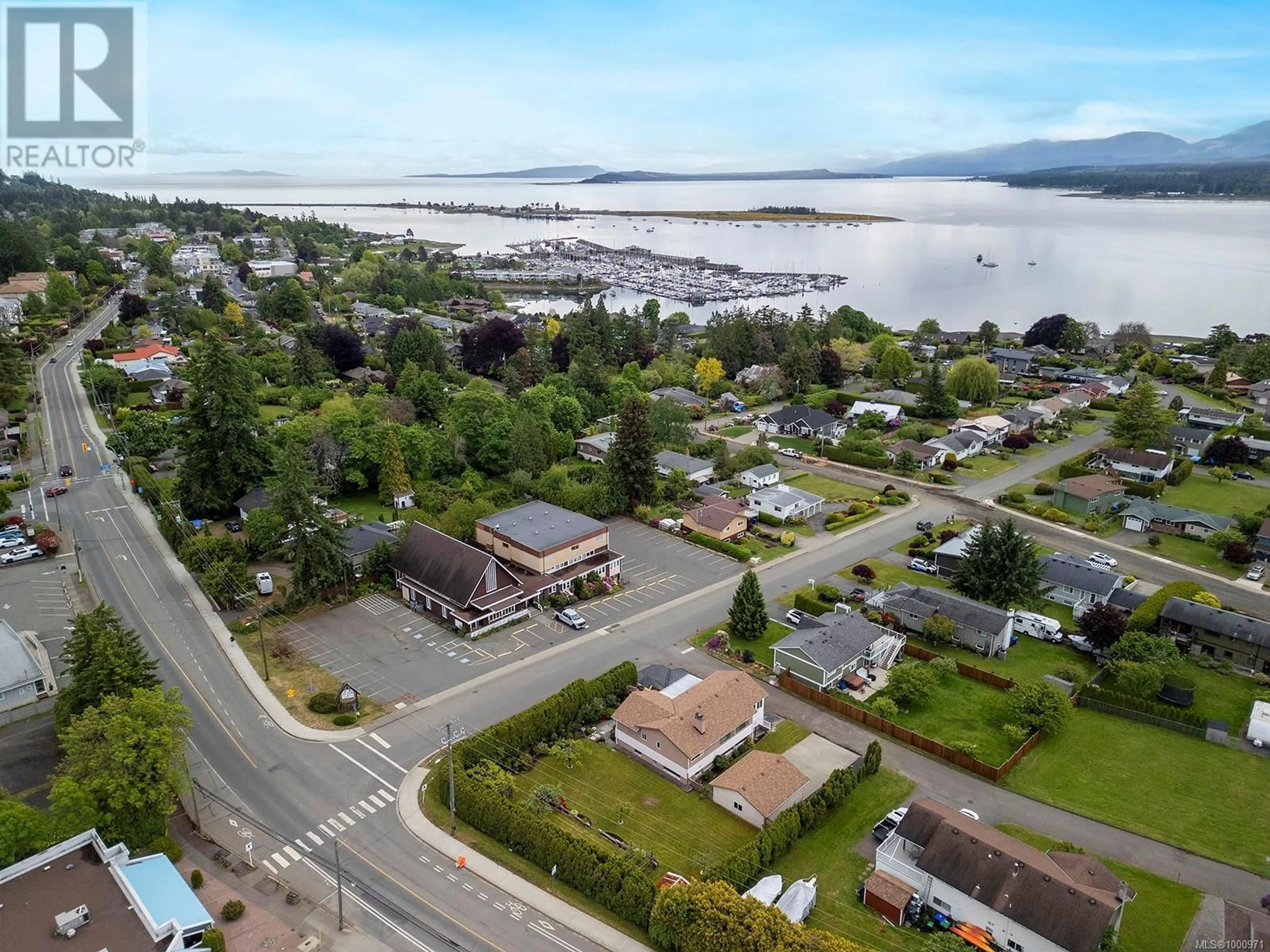 A pic from outside/outdoor area/front of a property/back of a property/a pic from drone, water/lake/river/ocean view for 251 BEACH DRIVE, Comox British Columbia V9N1W3