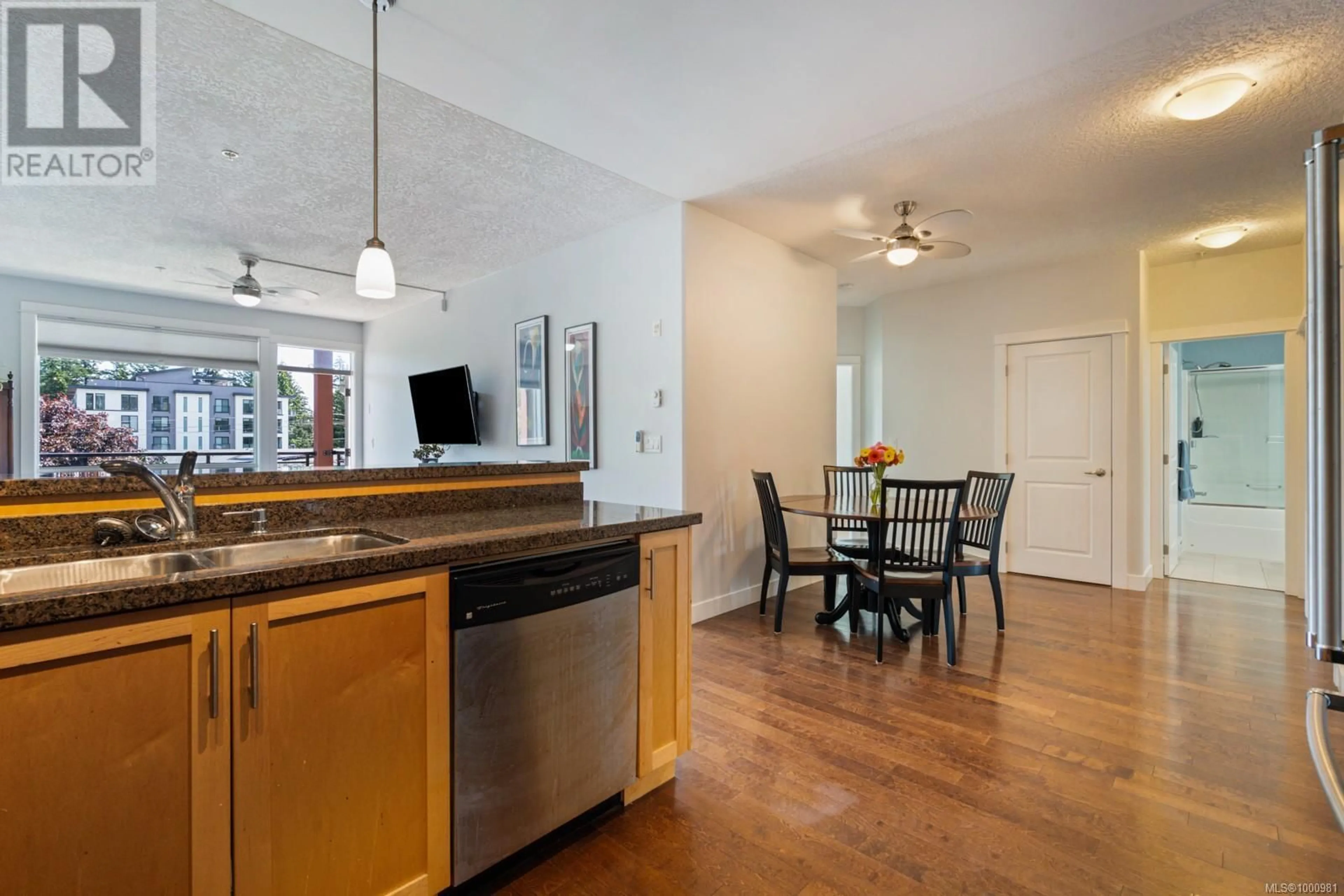 Open concept kitchen, wood/laminate floor for 307 - 2710 JACKLIN ROAD, Langford British Columbia V9B0K5